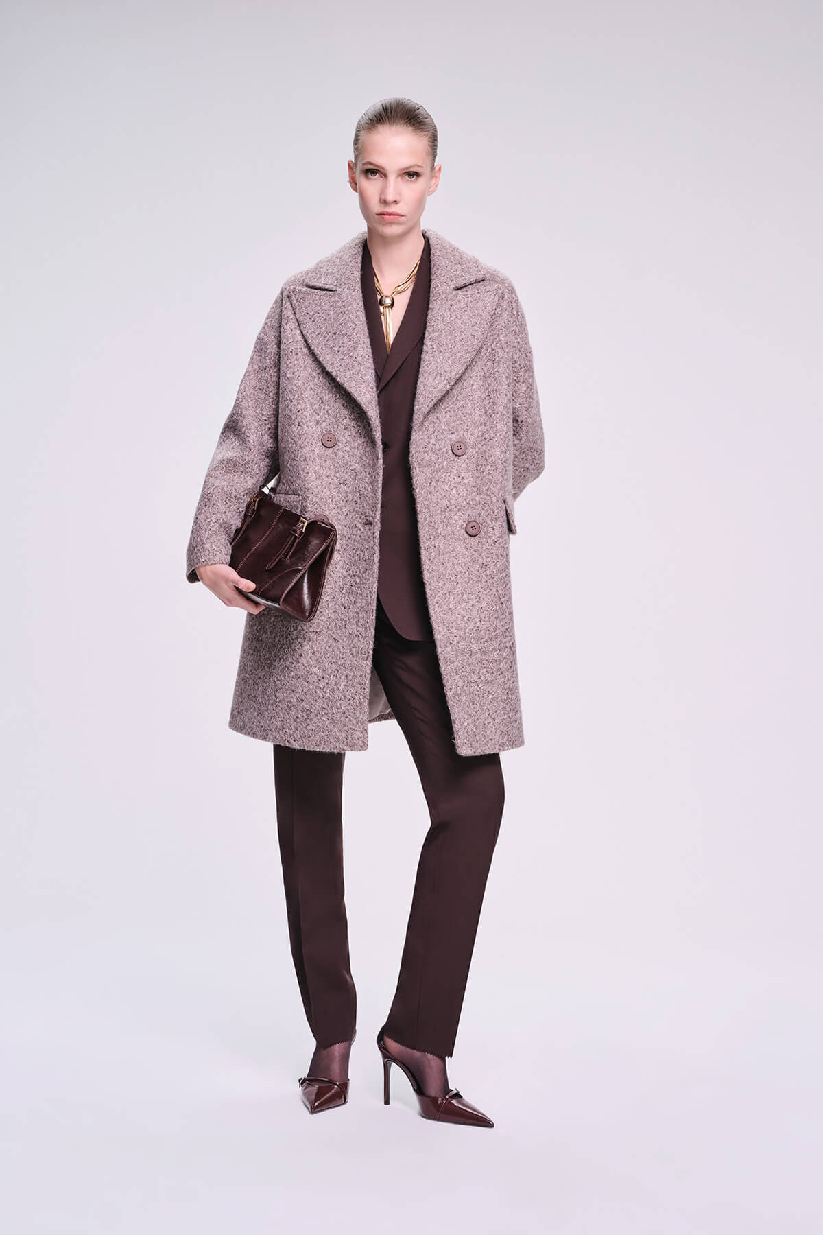 A taupe wool-blend double-breasted coat with a textured, slightly mottled finish and classic notched lapels.