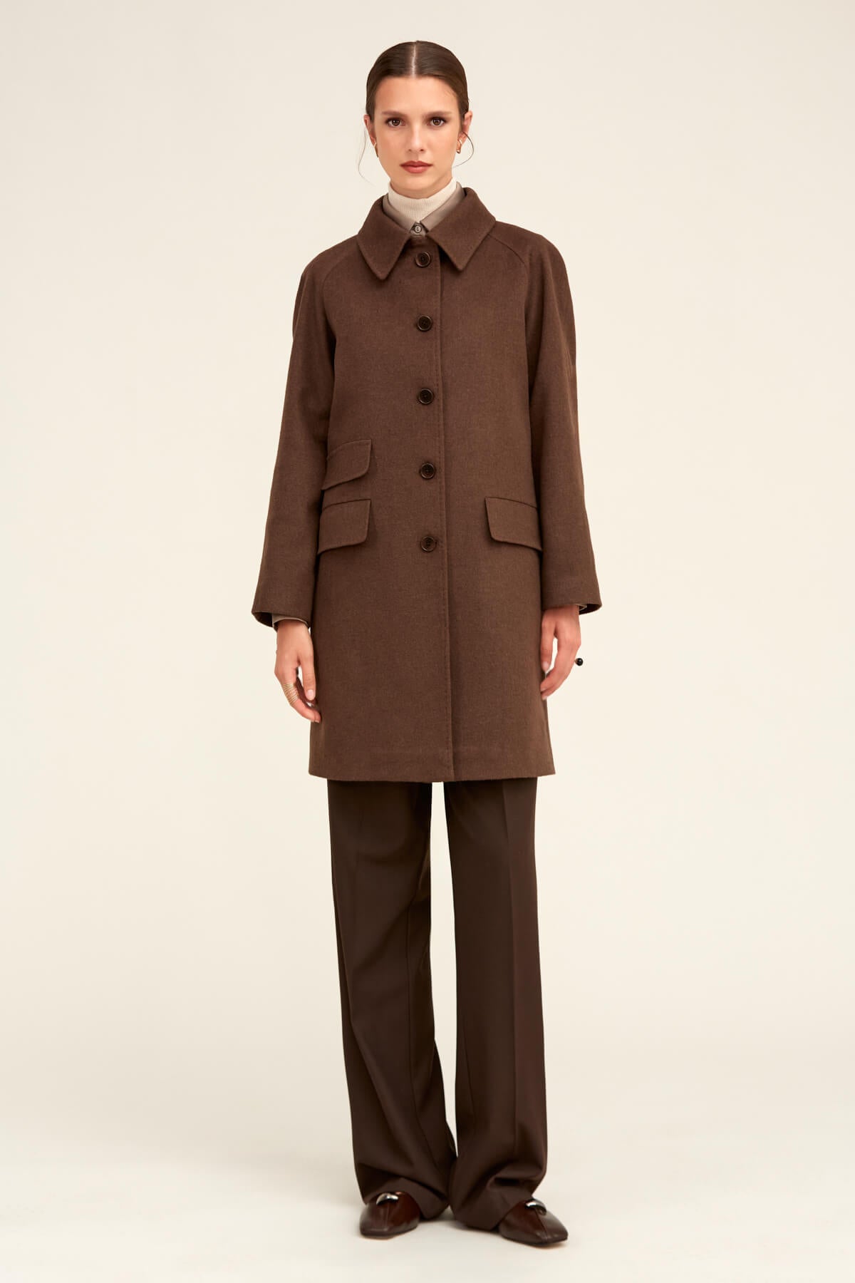 Brown wool coat with a classic collar and front button closure.