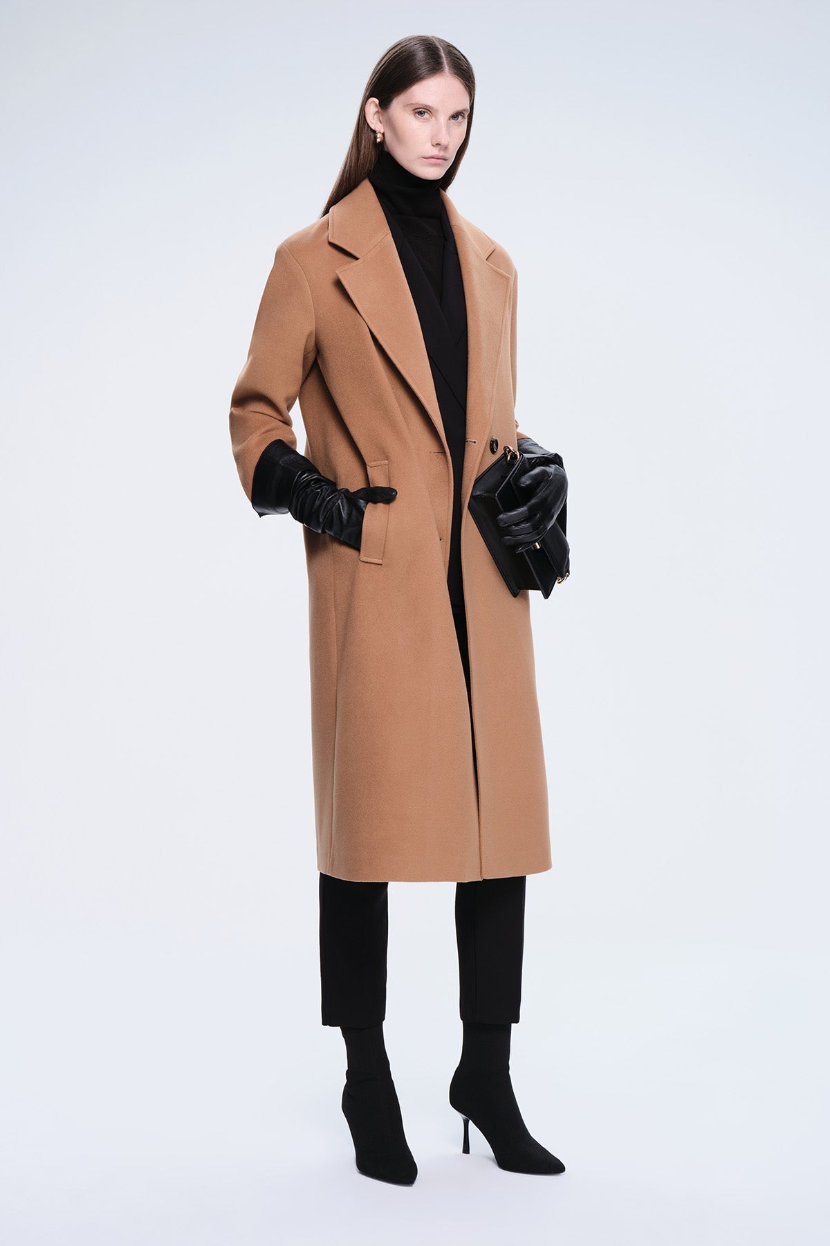 A sleek camel-colored wool coat with a classic double-breasted design and notched lapels.