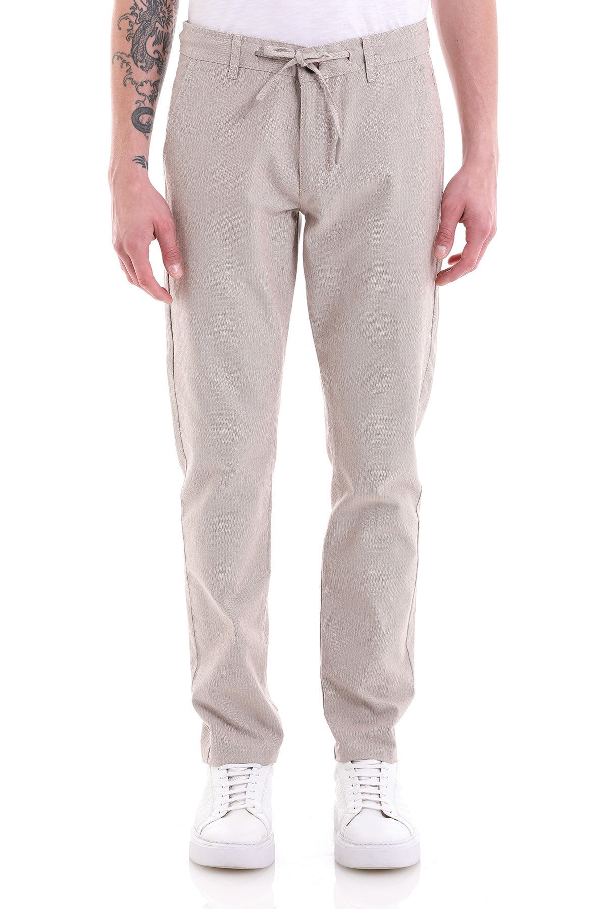 Beige corduroy chino pants with a drawstring waistband.