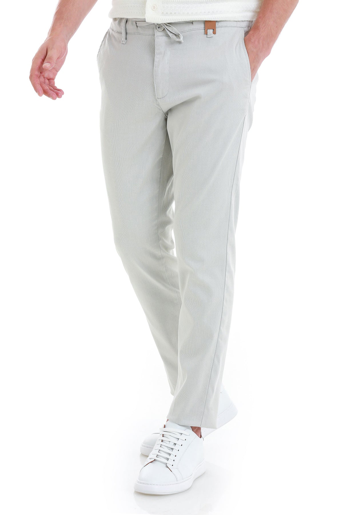 Light gray chino pants with a drawstring waistband and subtle vertical seam detailing.