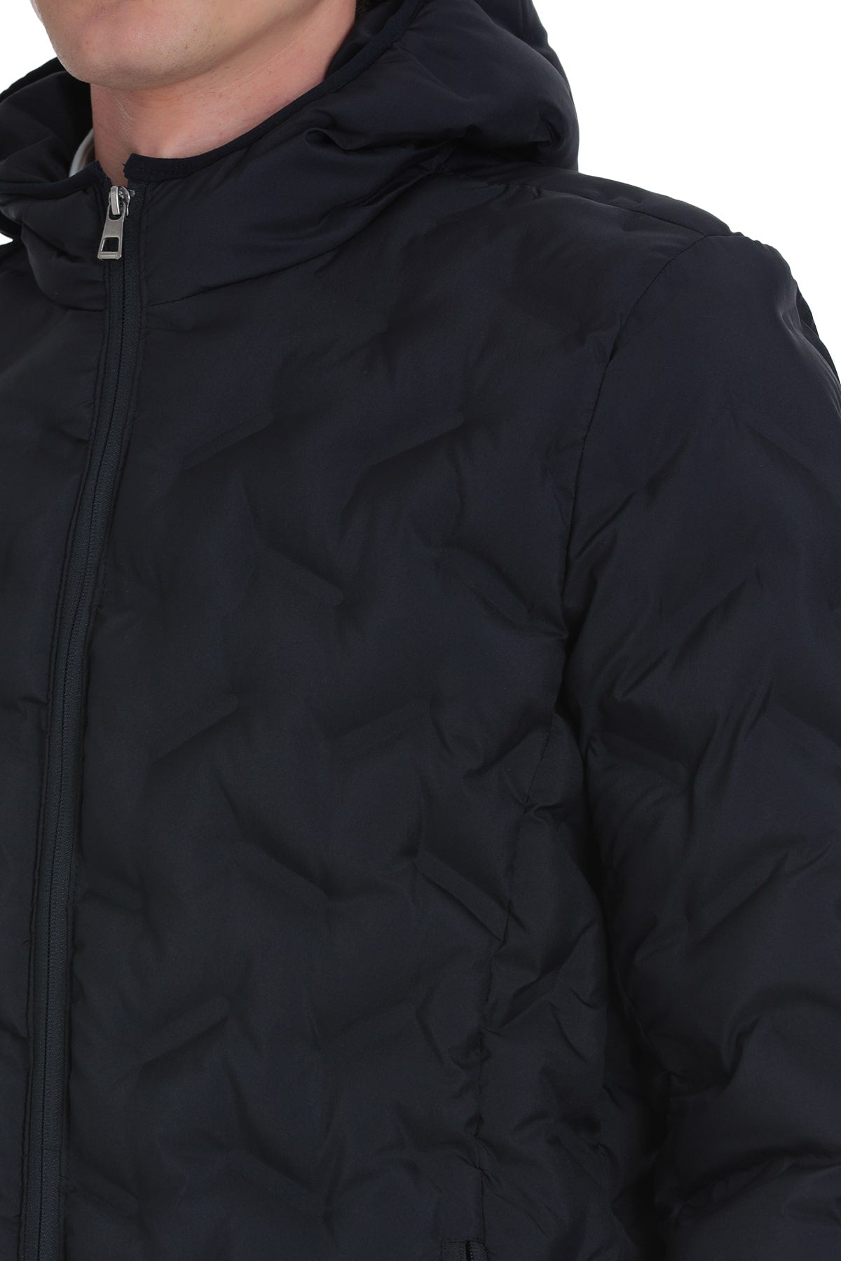 Black quilted hooded jacket with a sleek zipper and subtle texture.
