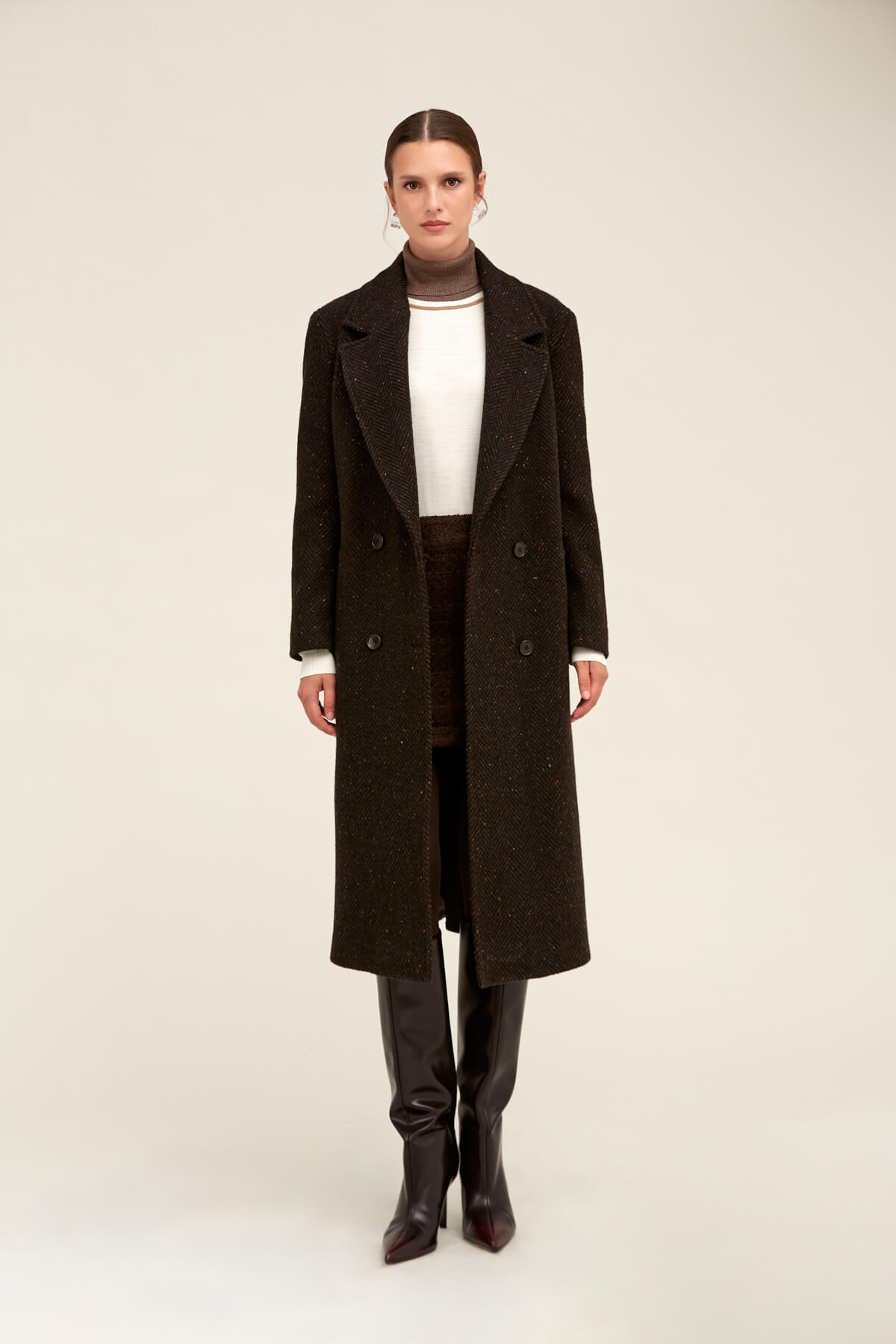 Black double-breasted wool coat with subtle glittery texture.