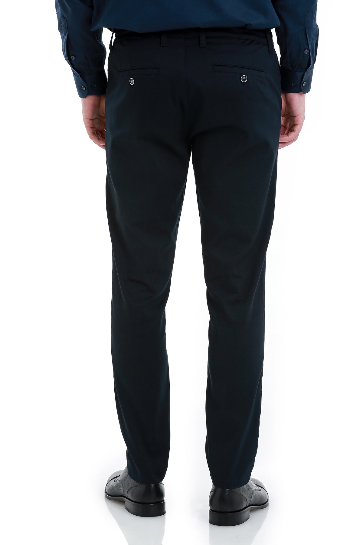 Black tailored trousers with subtle stitching and silver-toned button details on the back pockets.