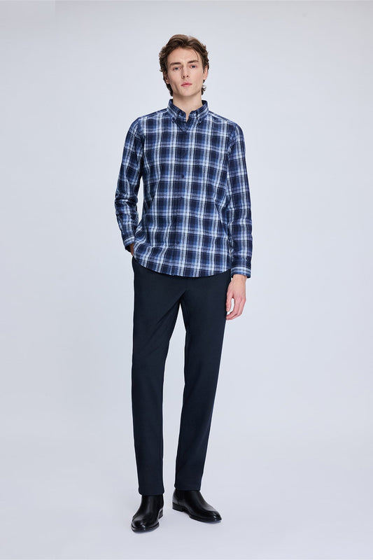 A navy and white plaid long-sleeved button-up shirt with a classic collar.