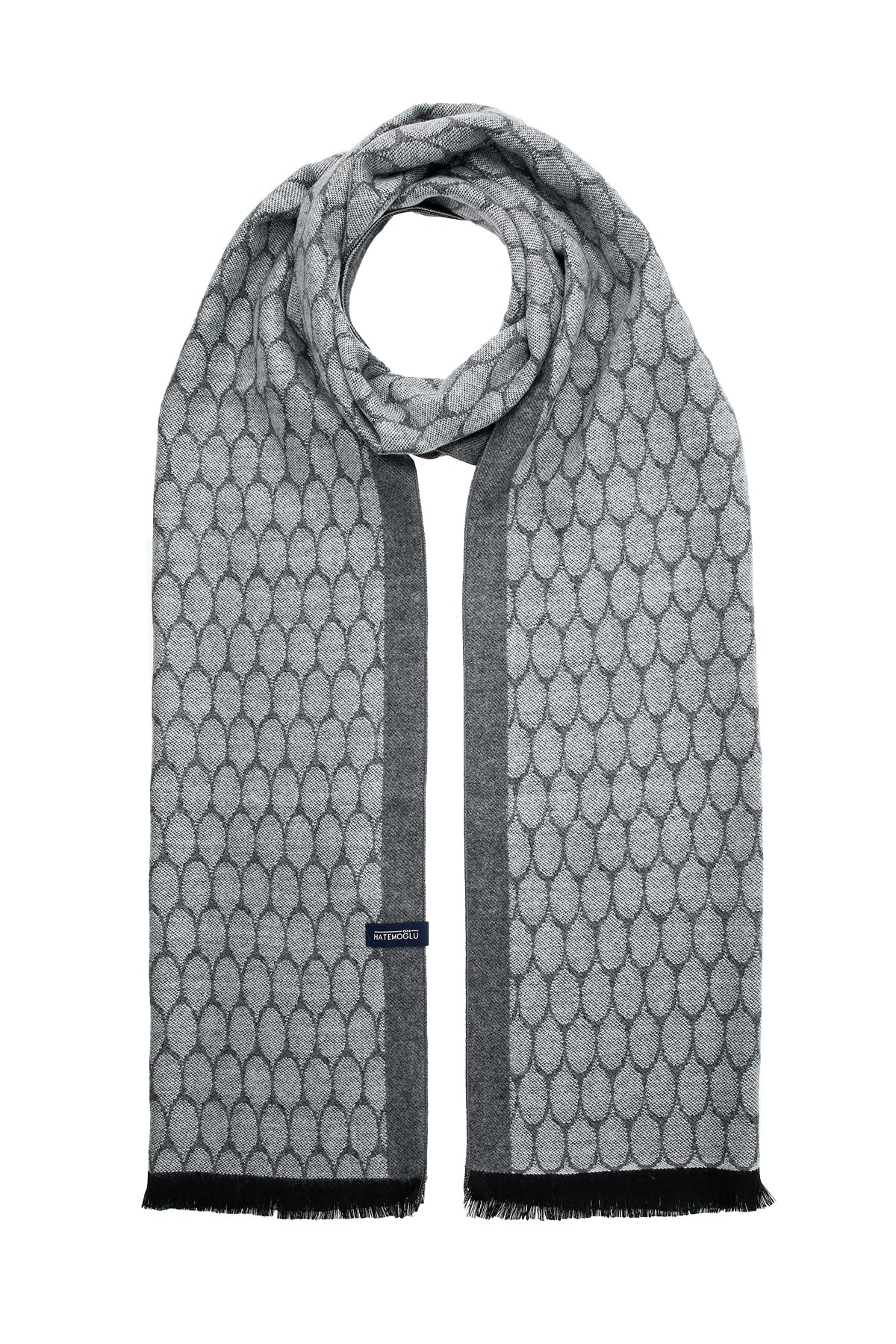 Gray scarf with a repeating geometric pattern and black fringe edges.