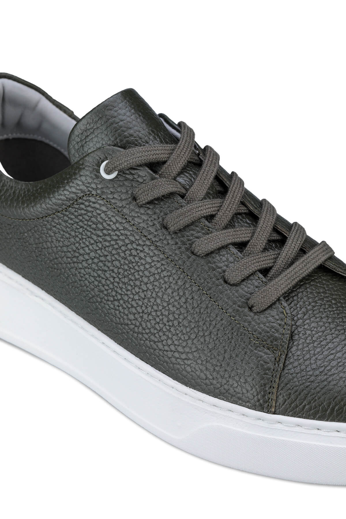Dark gray textured leather sneaker with white rubber sole and matching laces.