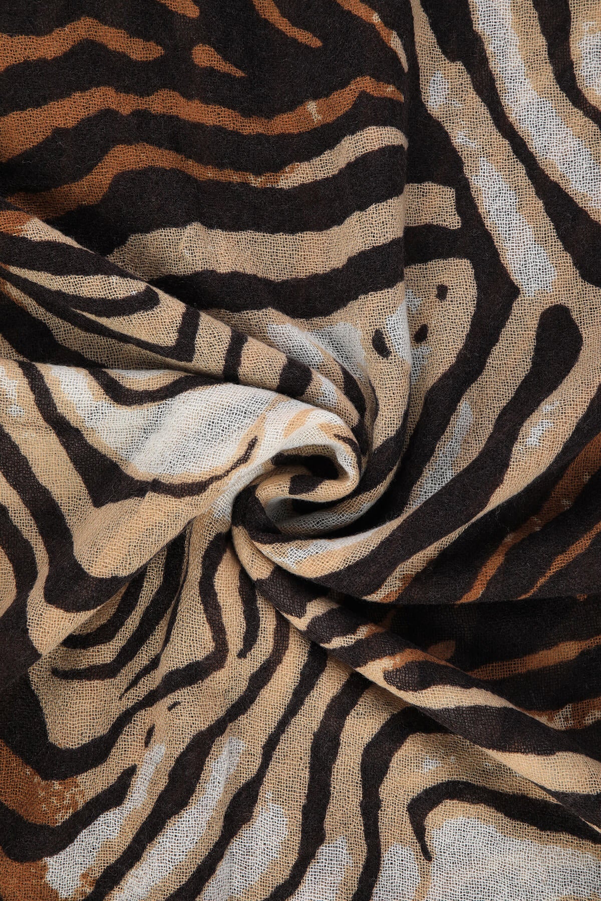 A soft, flowing scarf featuring a bold zebra print with black and tan stripes.