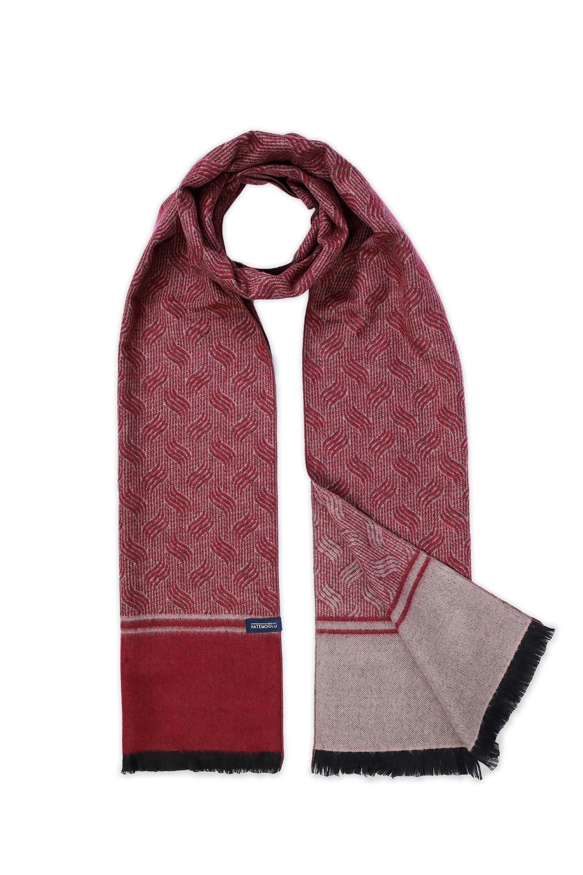 A maroon and beige patterned scarf with a subtle geometric design, featuring black fringed edges and a branded tag at the bottom.