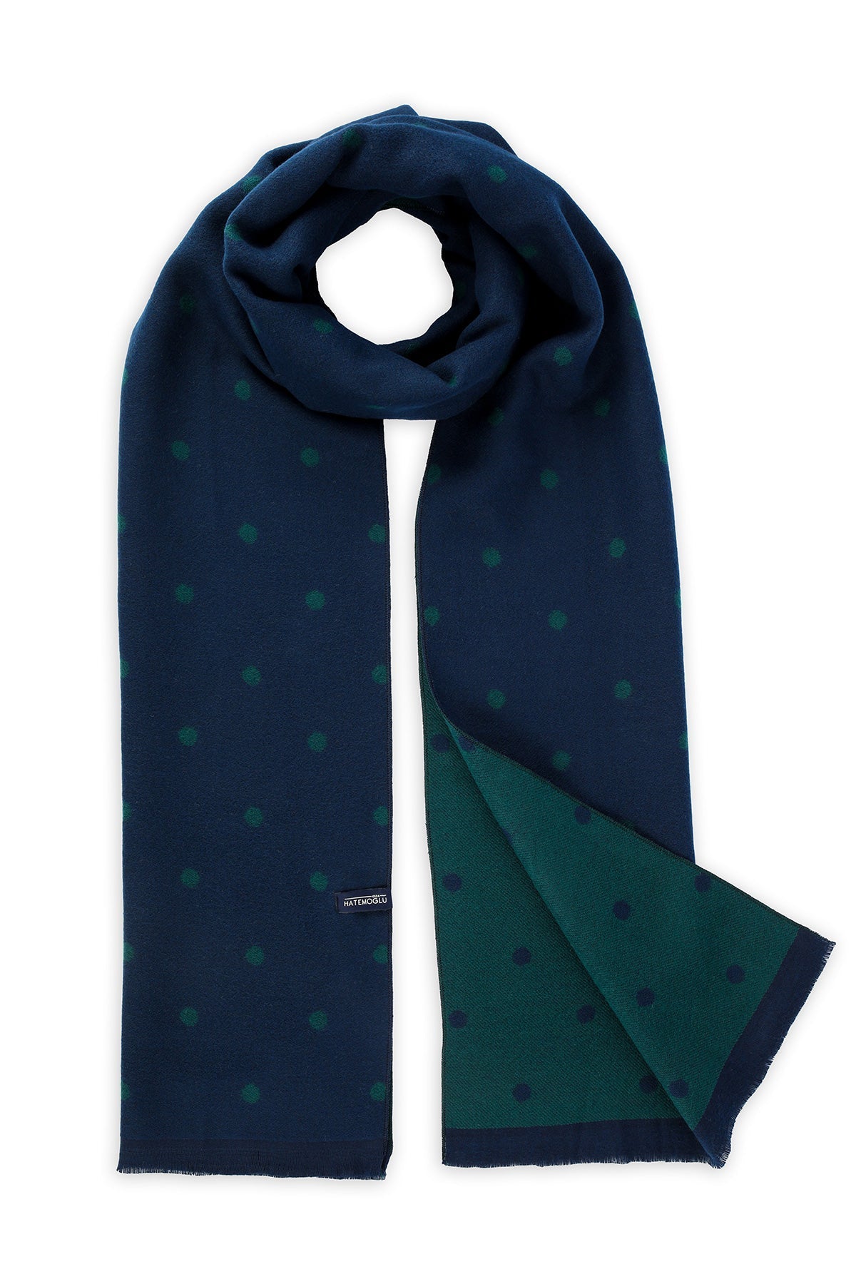 Navy blue scarf with subtle green polka dots and a contrasting teal inner lining