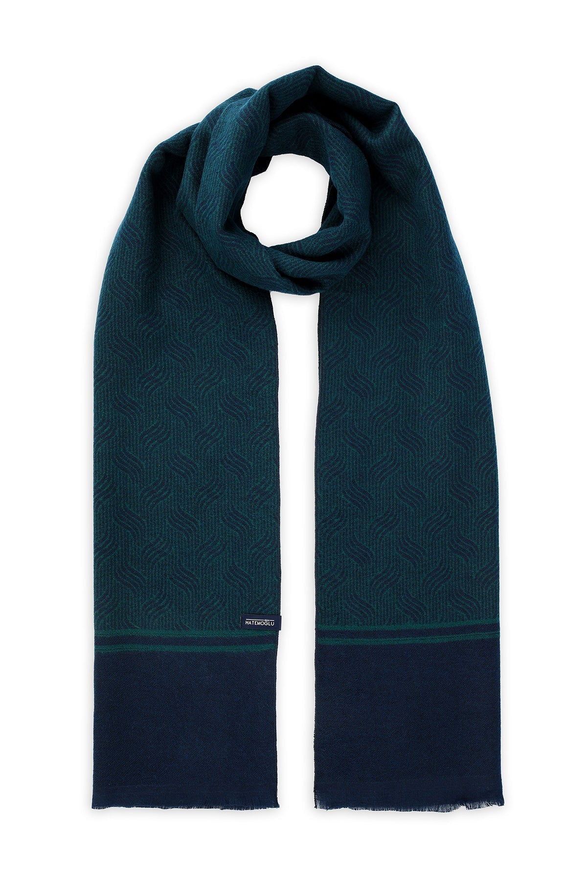 Deep teal scarf with a subtle geometric pattern and navy blue fringe at the ends.