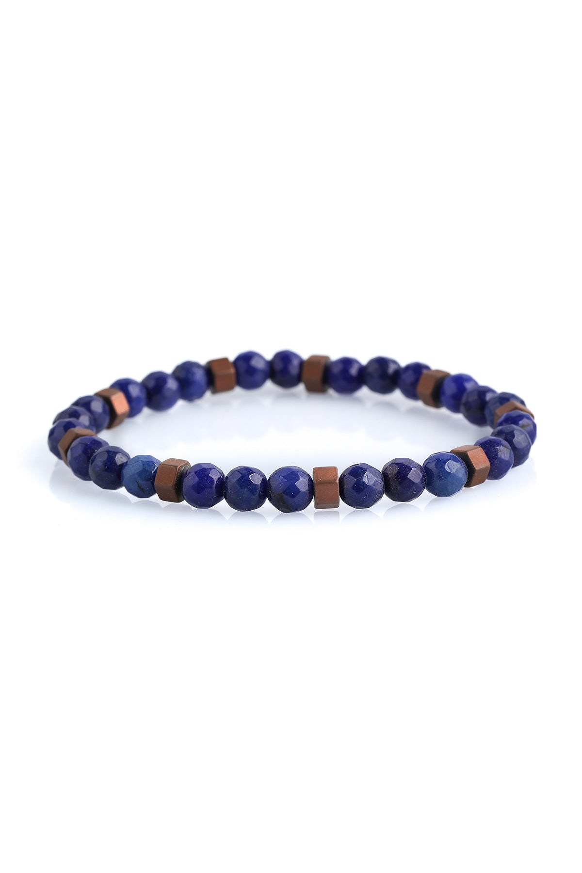 A delicate stretchy bracelet featuring alternating deep blue faceted lapis lazuli beads and small copper-toned square spacer beads.
