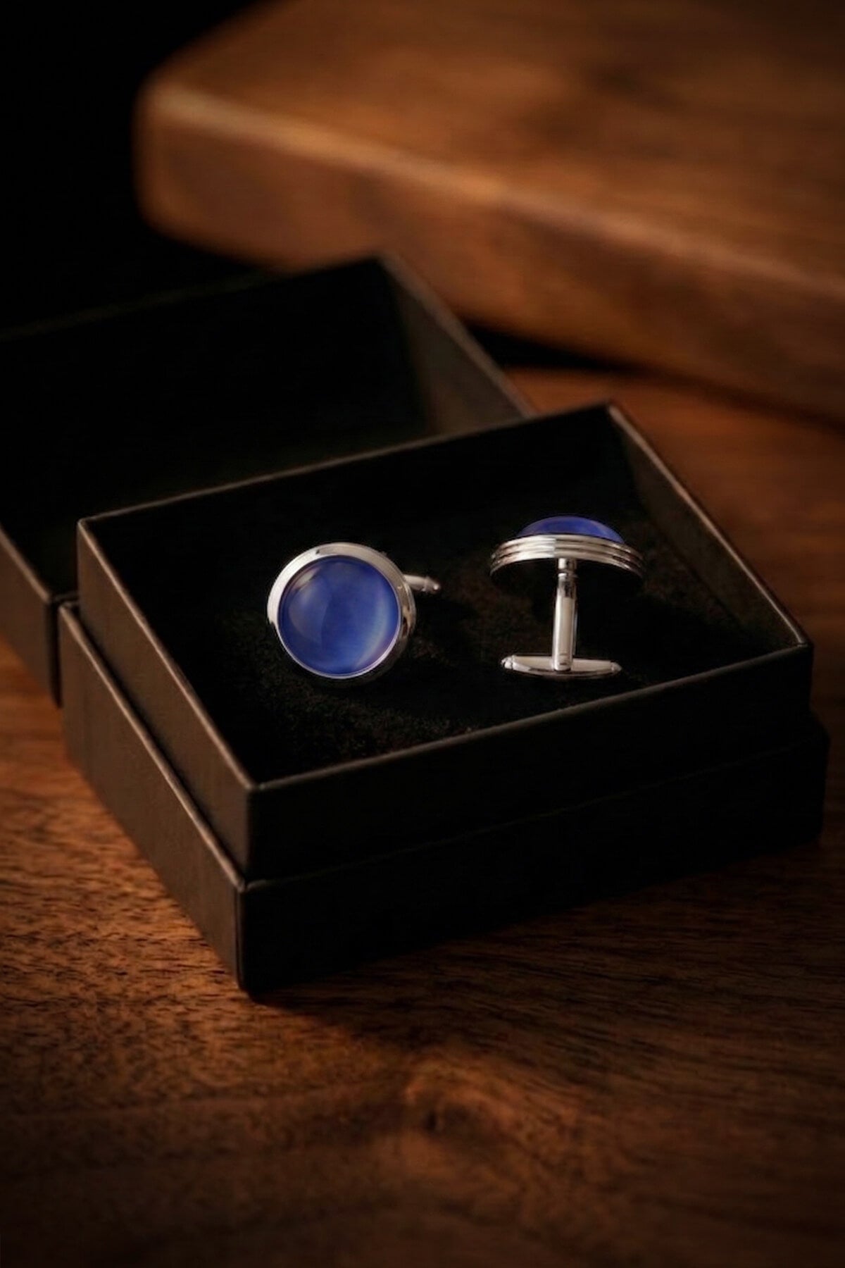 Silver round cufflinks featuring deep navy natural stone inlays for a classic elegant accessory