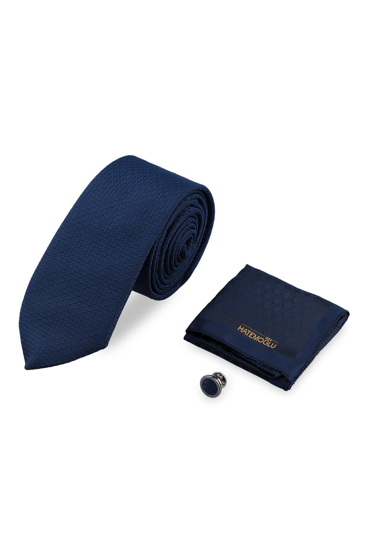 Navy patterned tie made of textured silk paired with pocket square and lapel pin in a 3-piece set