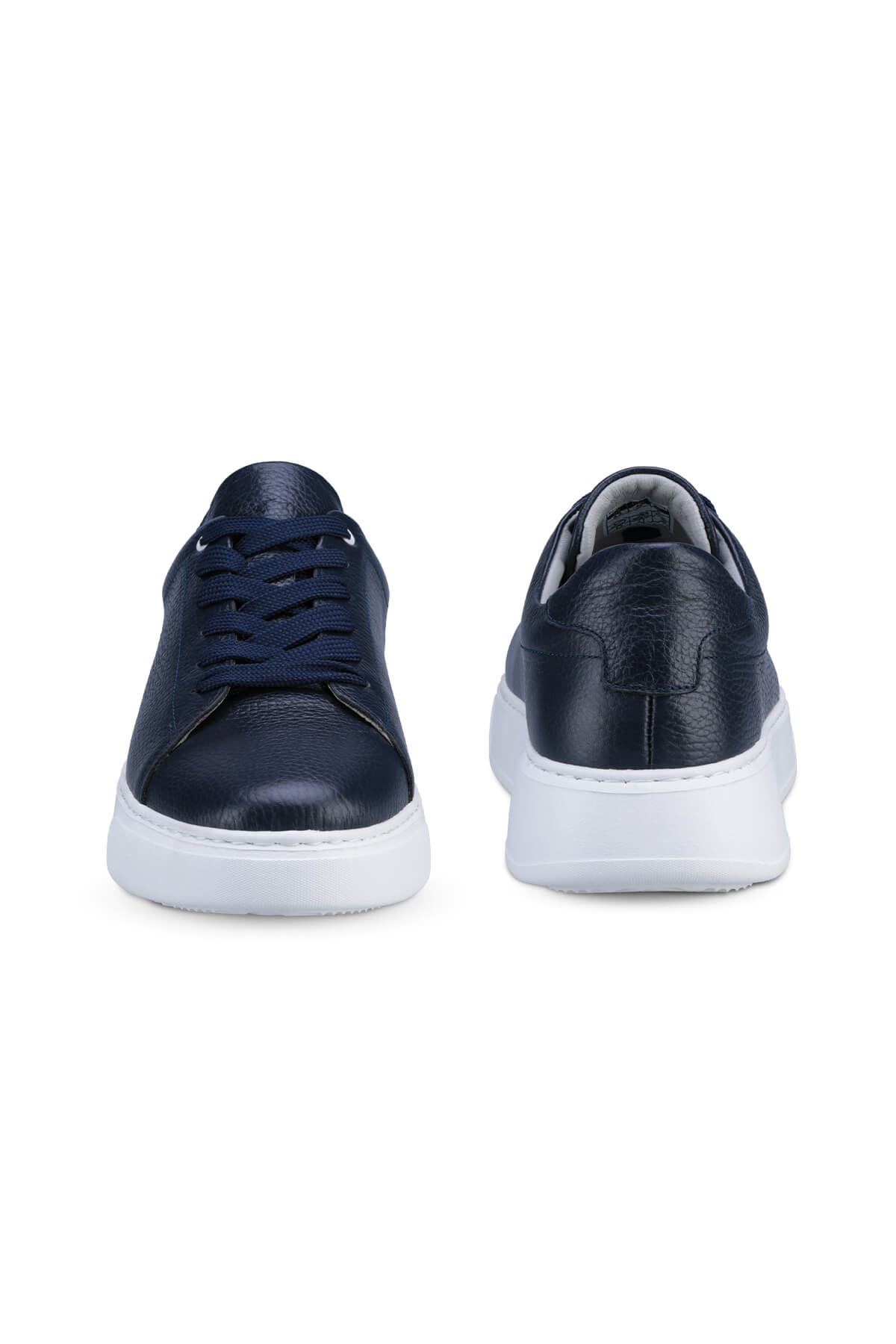 Navy blue leather sneakers with white rubber soles
