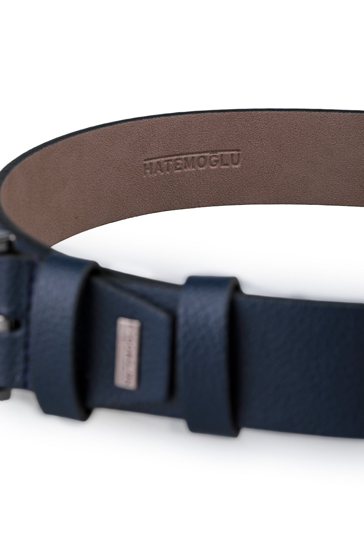 Dark blue leather belt with a minimalist buckle and embossed brand name on the inner lining.