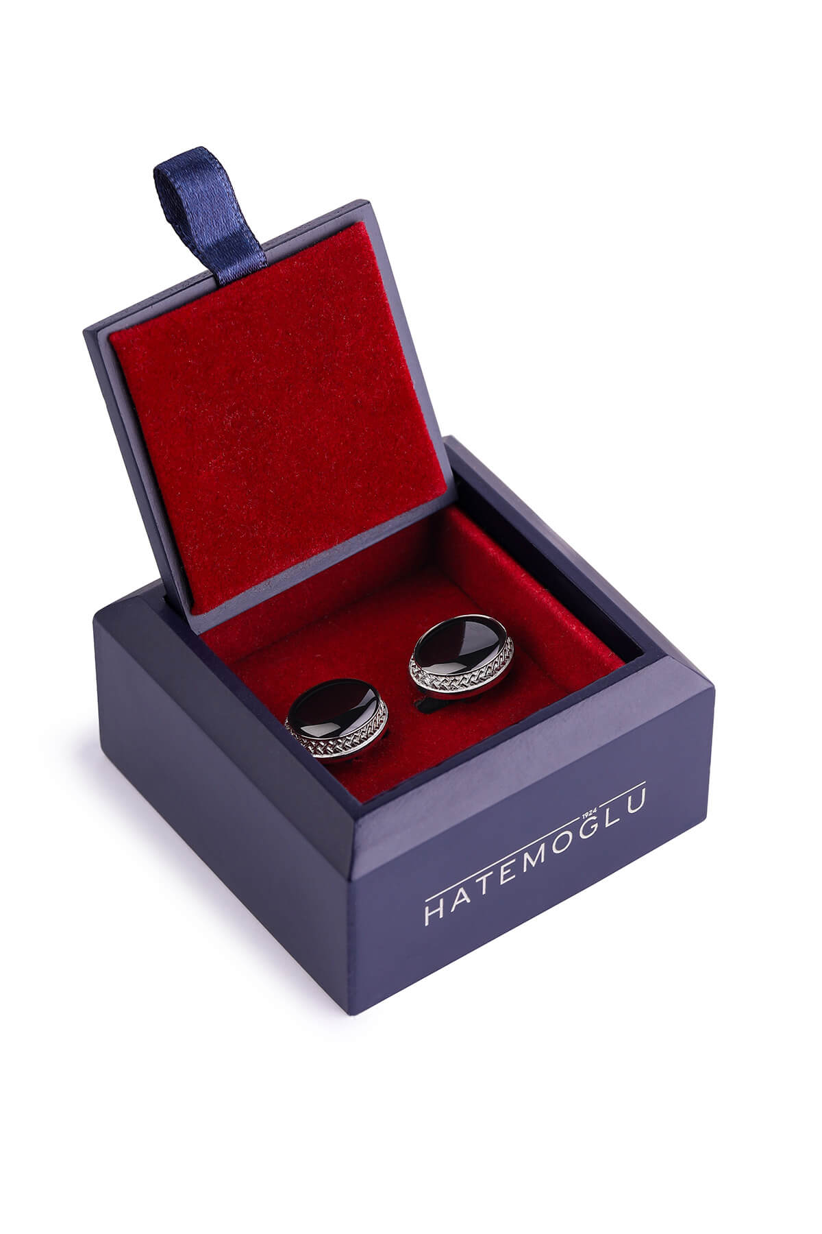 Black onyx cufflinks with a silver-toned, beaded border sit elegantly in a navy blue velvet-lined box.