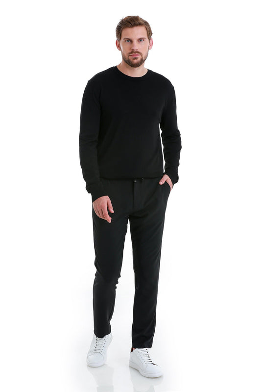 Black long-sleeved crewneck sweater with a smooth, fitted silhouette.