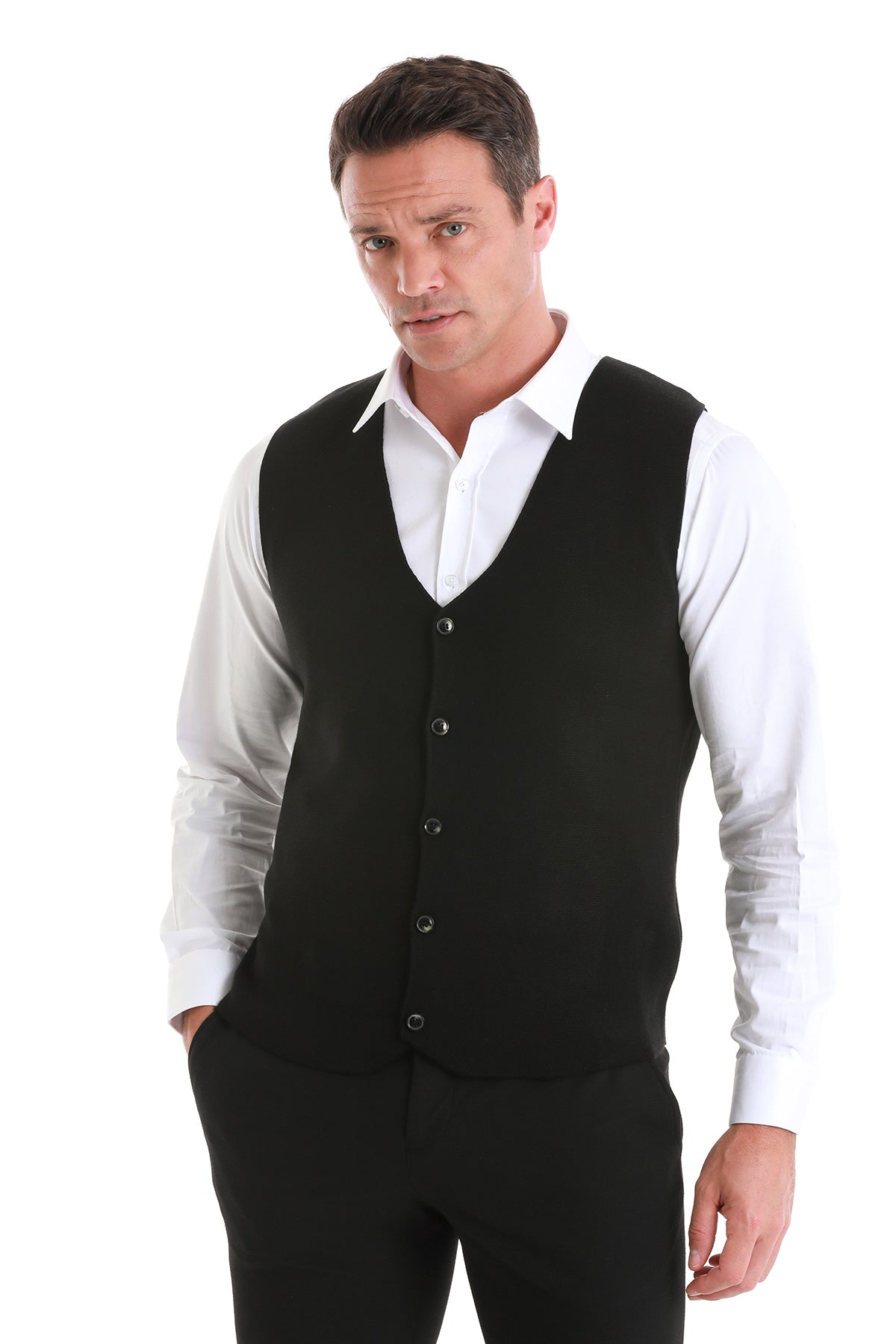 Black knit vest with button closure.