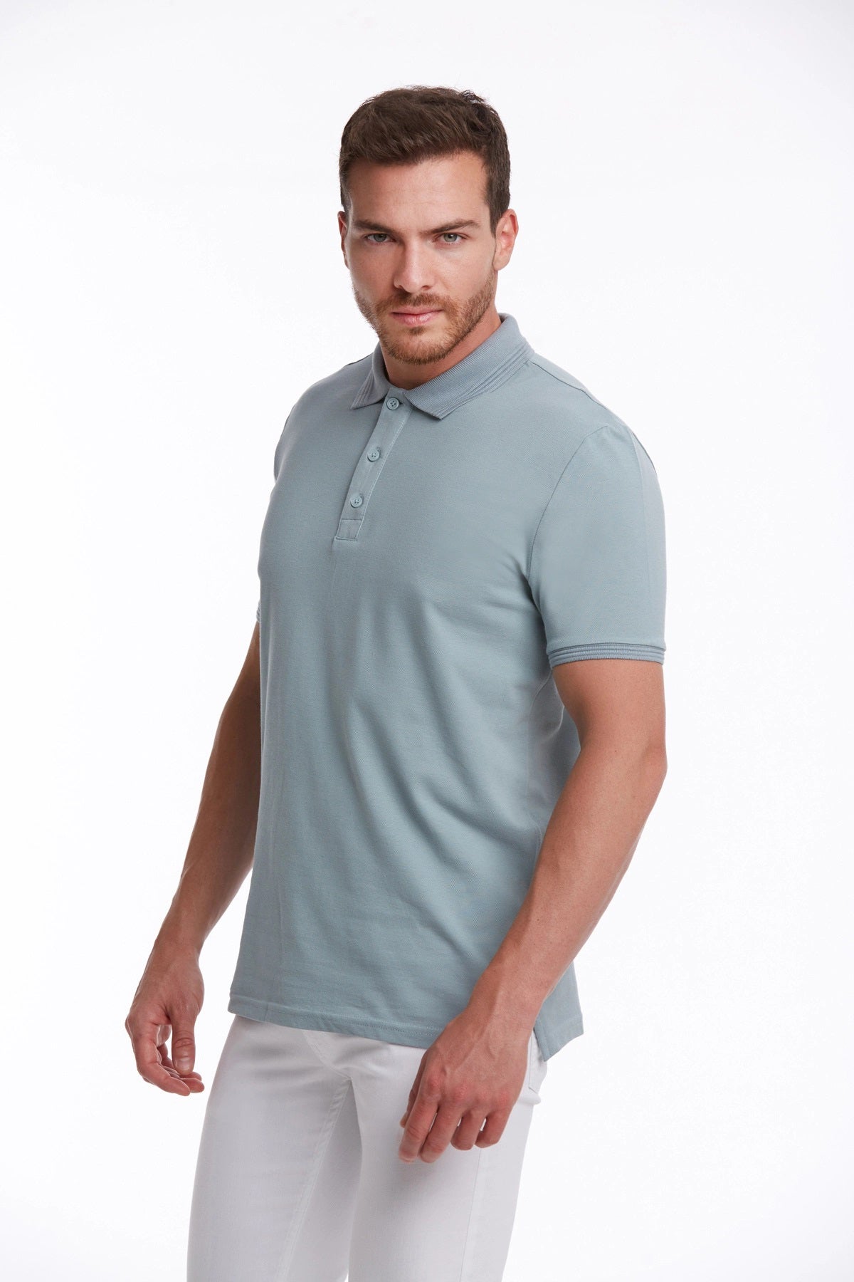 A light blue, short-sleeved polo shirt with a classic collar and buttoned placket.