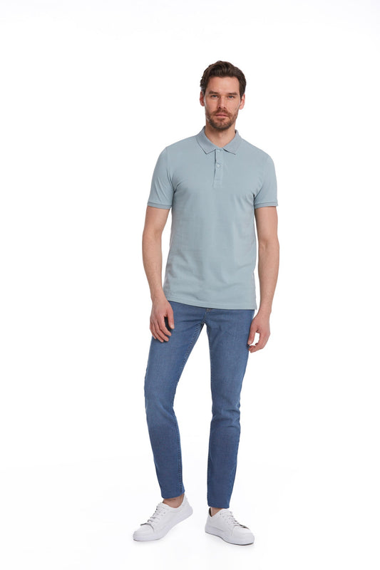 A man wearing a light blue, short-sleeved polo shirt with a classic collar and buttoned placket.