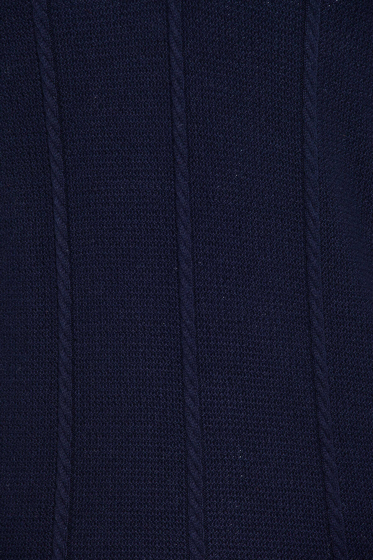 Dark navy blue knitted fabric with a textured, ribbed pattern.