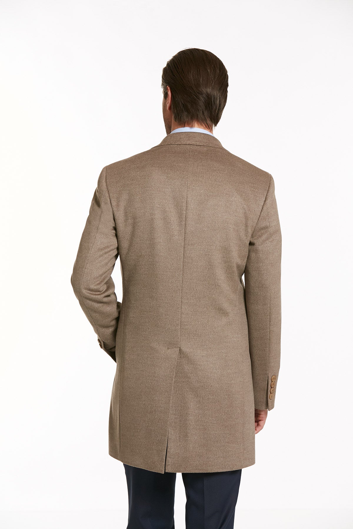 A tan wool overcoat with a subtle herringbone pattern and notched lapel.