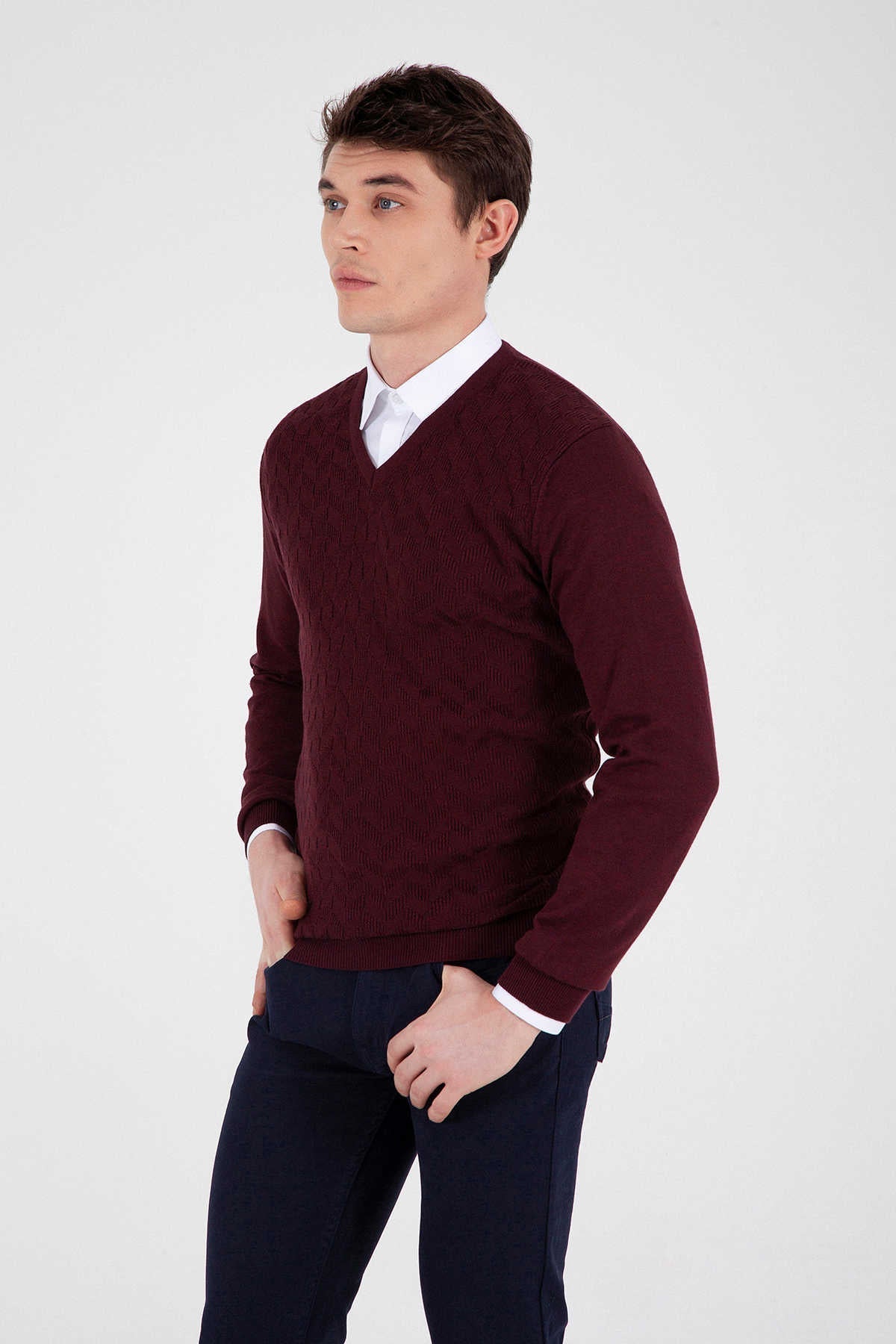 Maroon v-neck sweater with ribbed texture and white trim at cuffs.