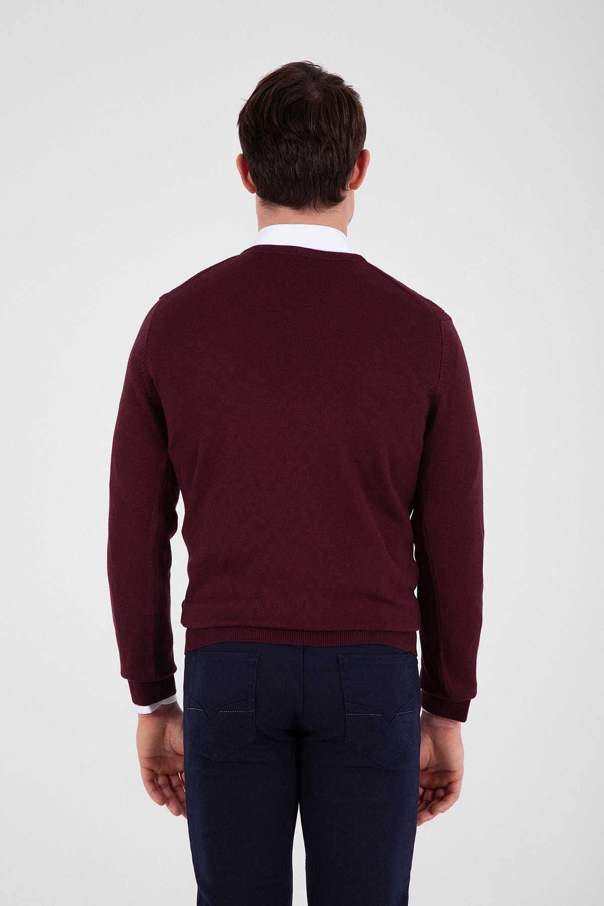 Maroon crewneck sweater with ribbed cuffs and hem.