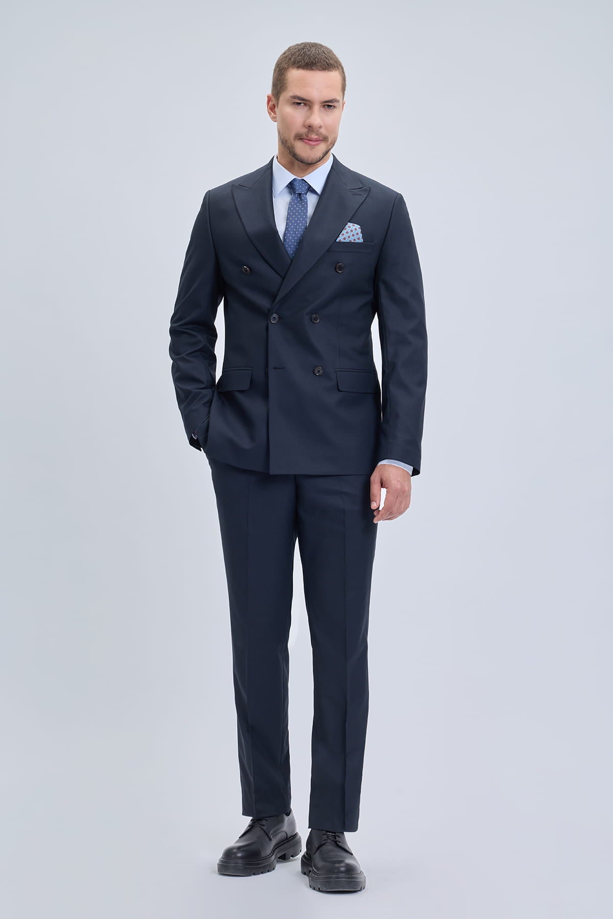 Regular fit double breasted peak lapel navy classic suit with subtle texture and matching patterned pocket square