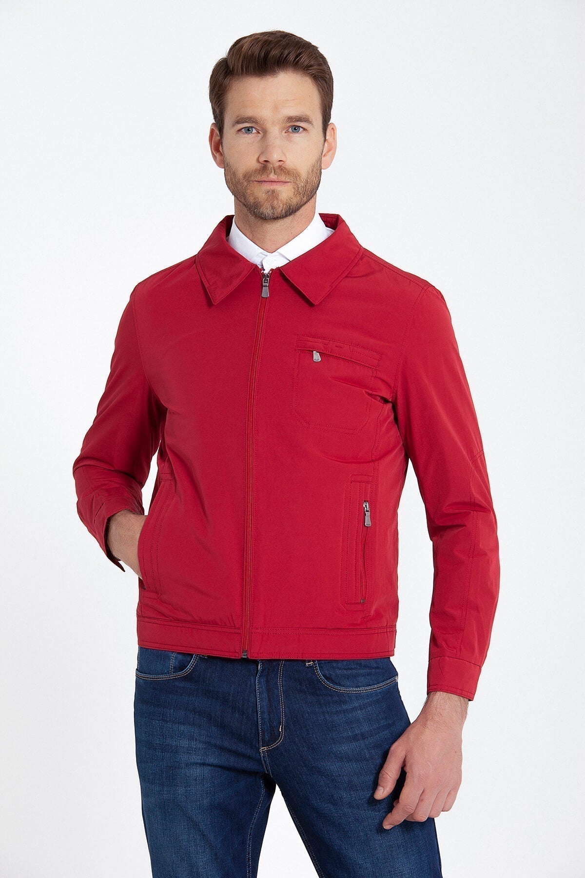 Red zip-up jacket with a collar and two front pockets, one featuring a zipper closure.