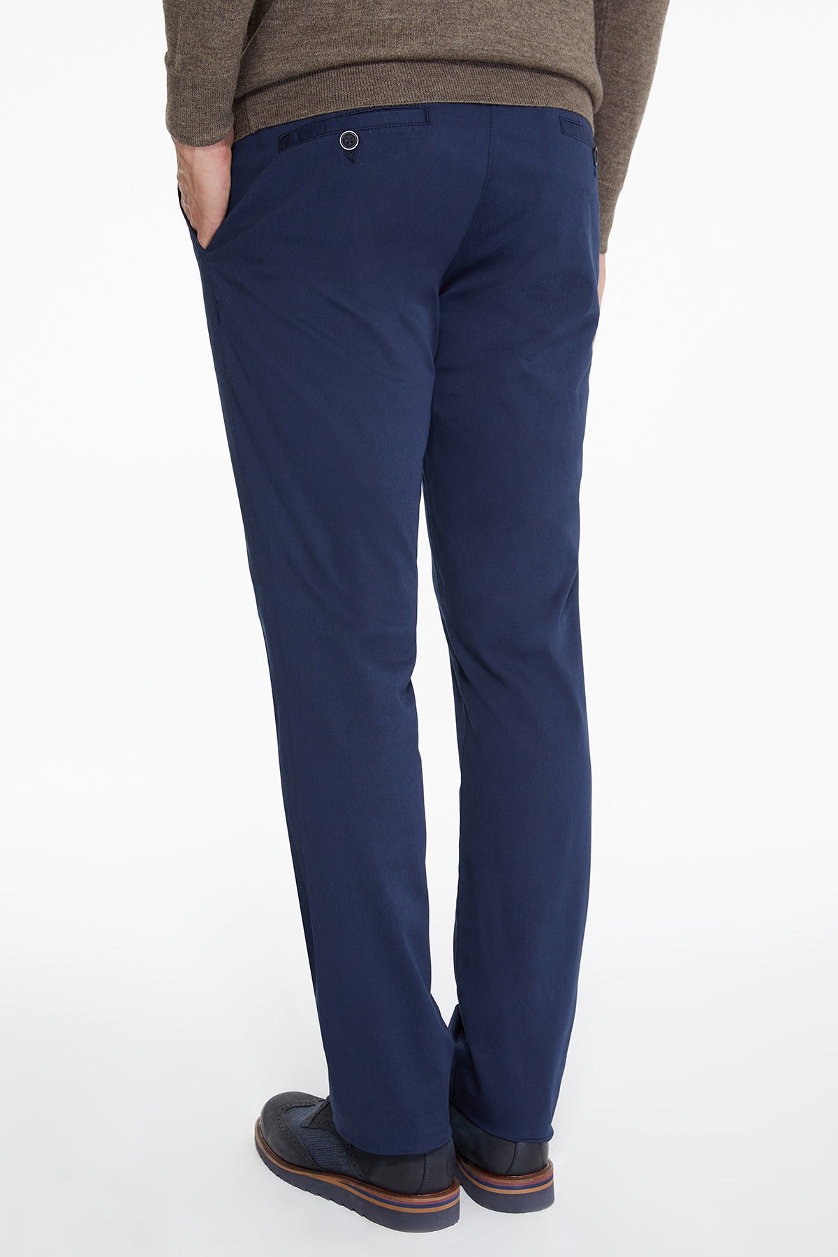 Navy blue tailored trousers with a subtle texture and a small circular button detail at the waistband