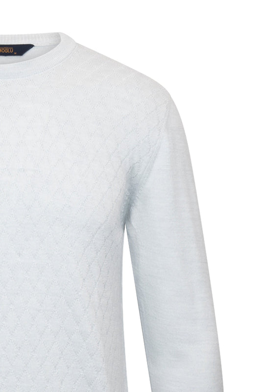 White crewneck sweater with a subtle textured pattern and a black ralph lauren brand tag at the neckline.