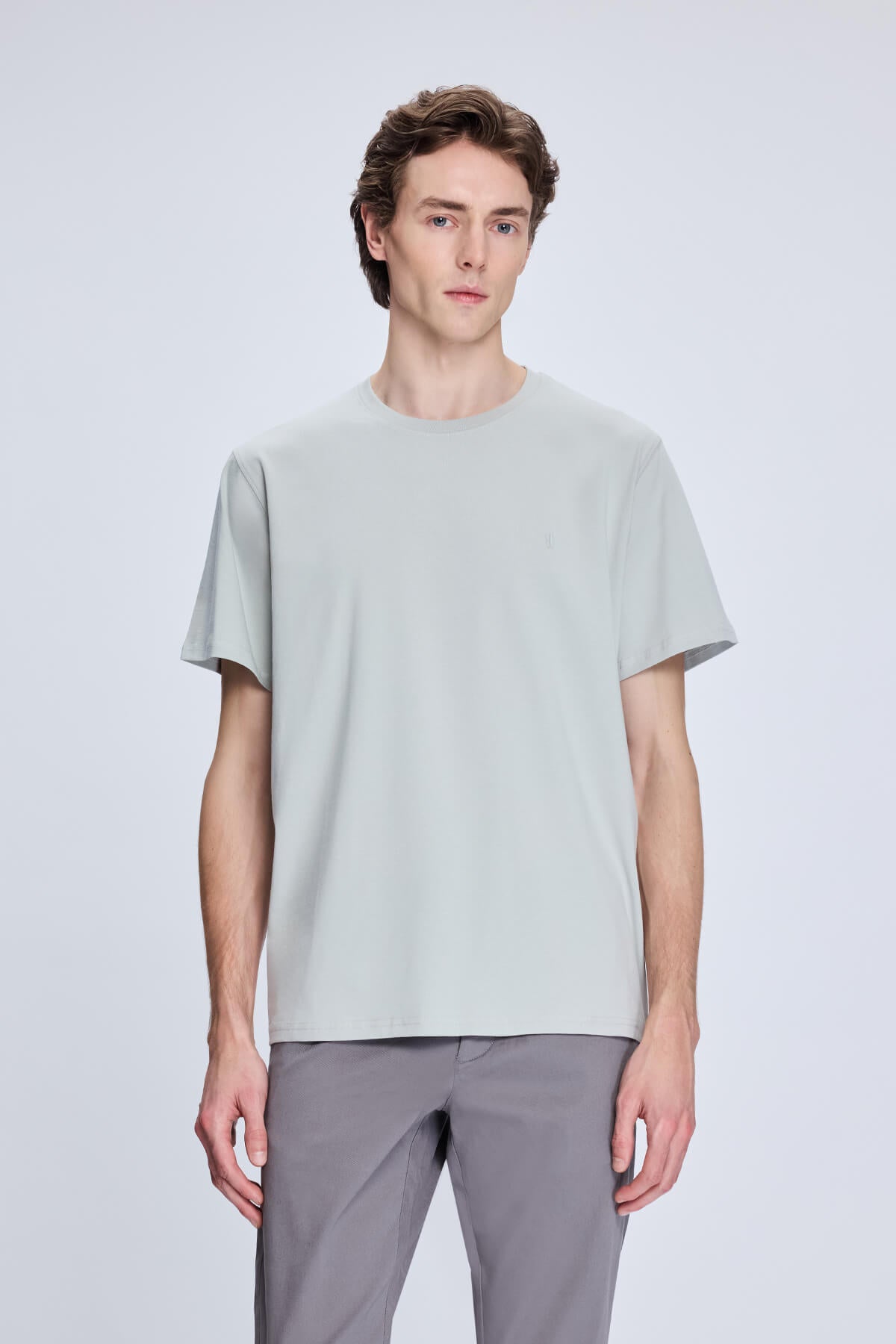 A light gray, minimalist short-sleeved t-shirt with a simple crew neckline.