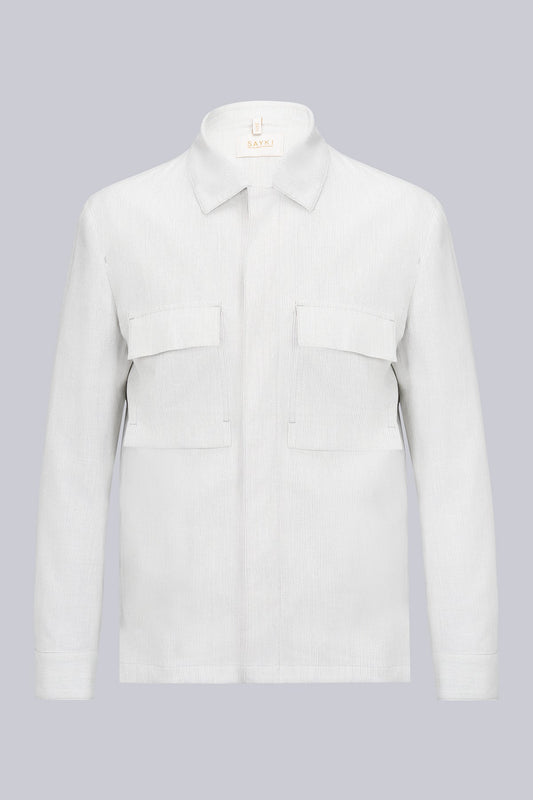 A crisp white corduroy shirt with a classic collar and two flap pockets on the chest.
