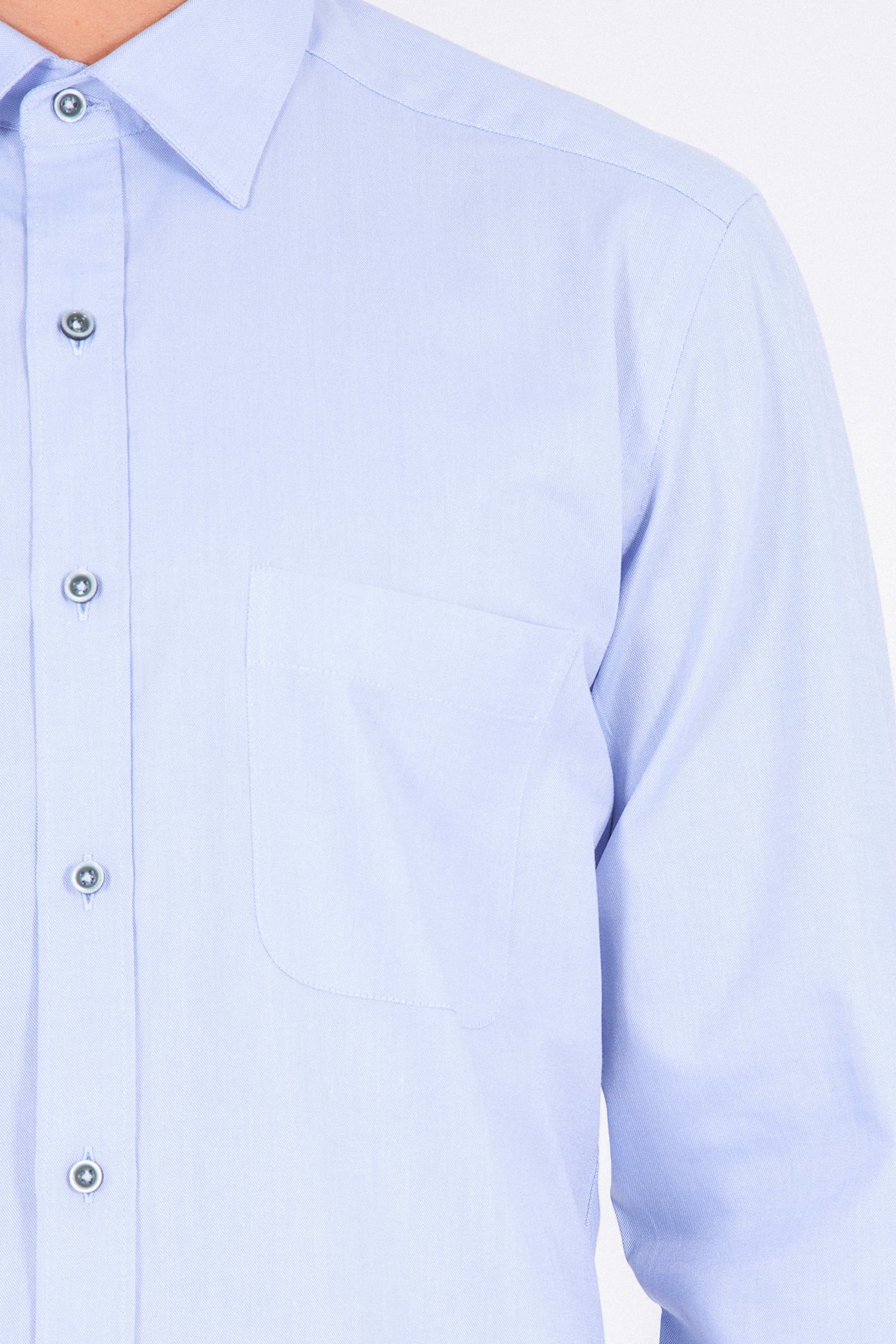 Light blue dress shirt with a crisp collar and matching button-down front.