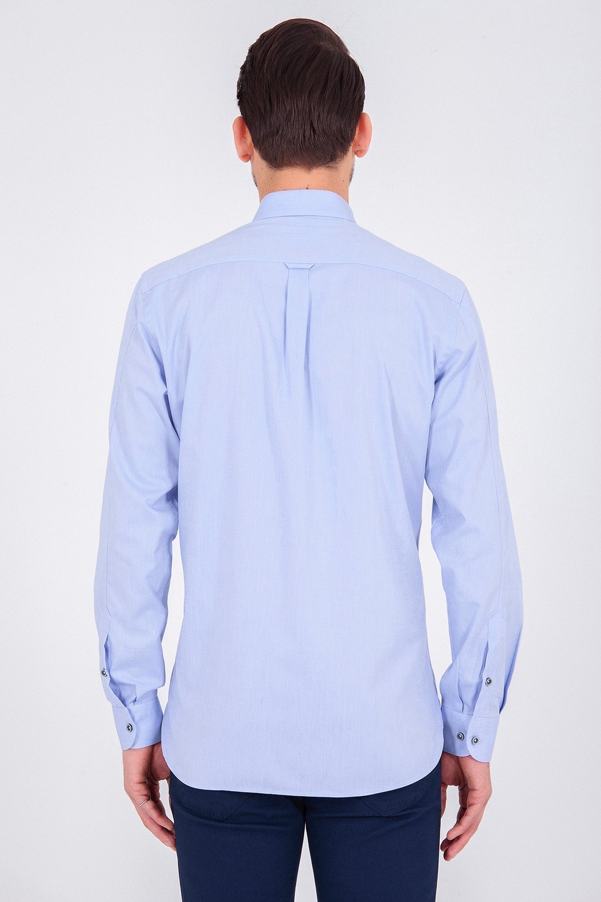 Light blue long-sleeved men’s dress shirt with a classic collar and buttoned cuffs.