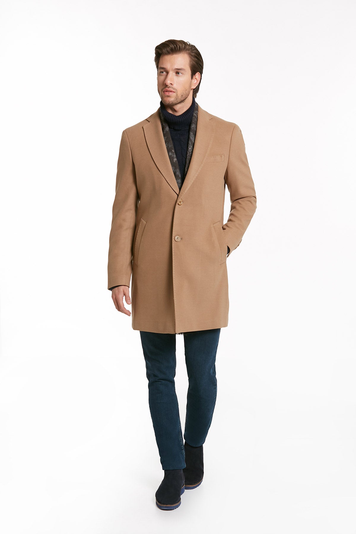 A tailored camel-colored wool overcoat with a notched lapel and two front buttons.