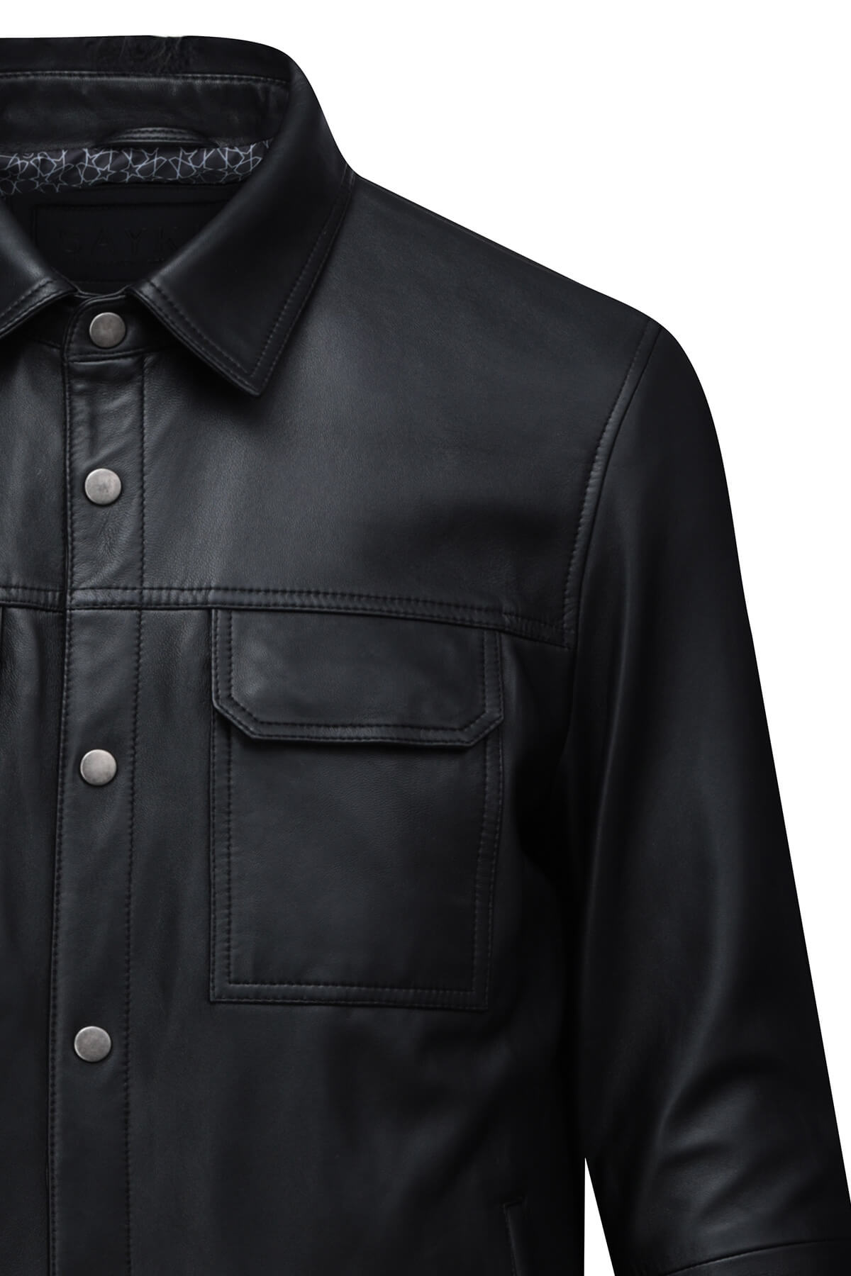 Black leather button-up shirt with silver-toned buttons and a subtle pattern lining the collar.