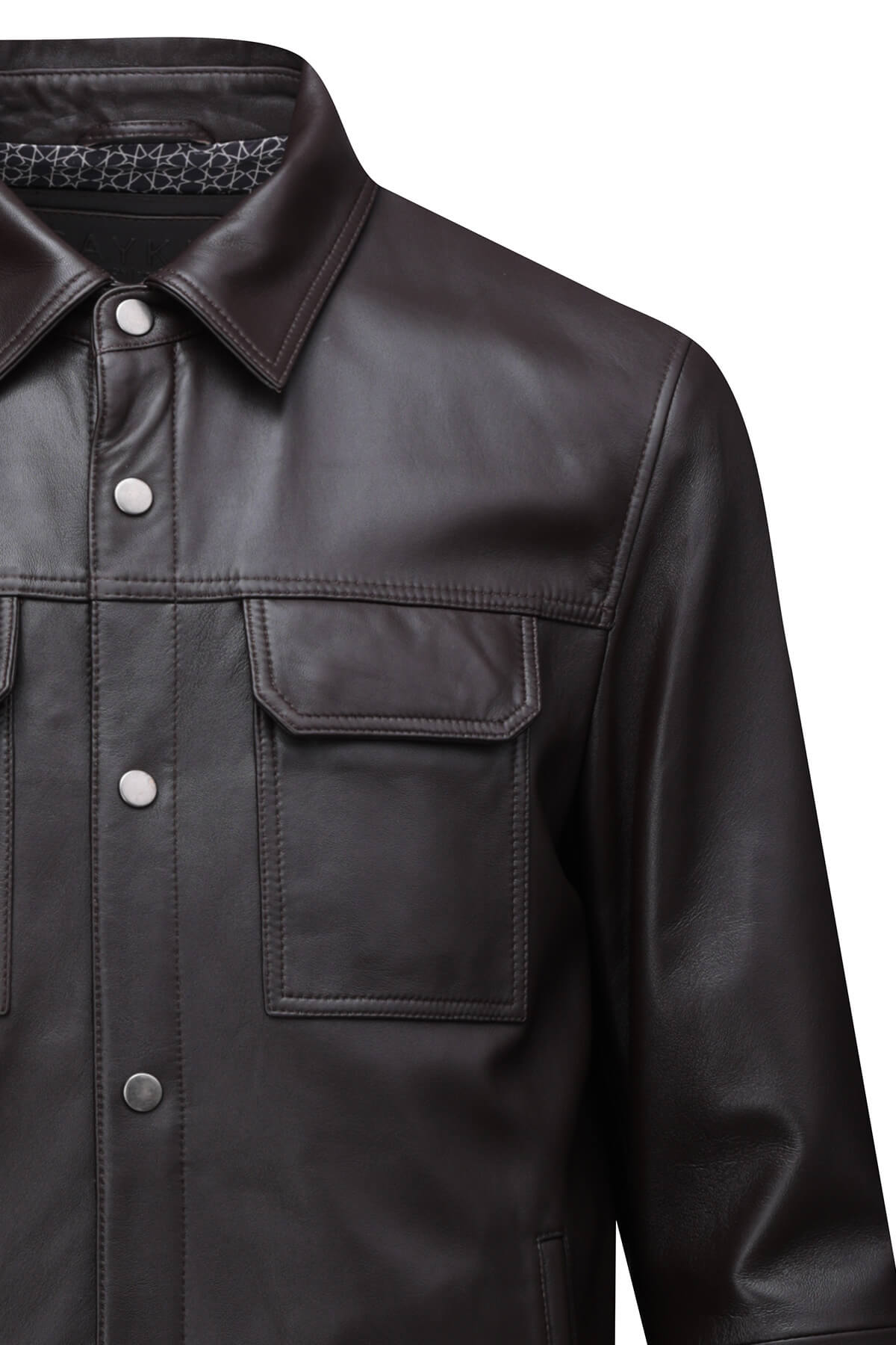 Black leather jacket with silver buttons and a subtle patterned lining.