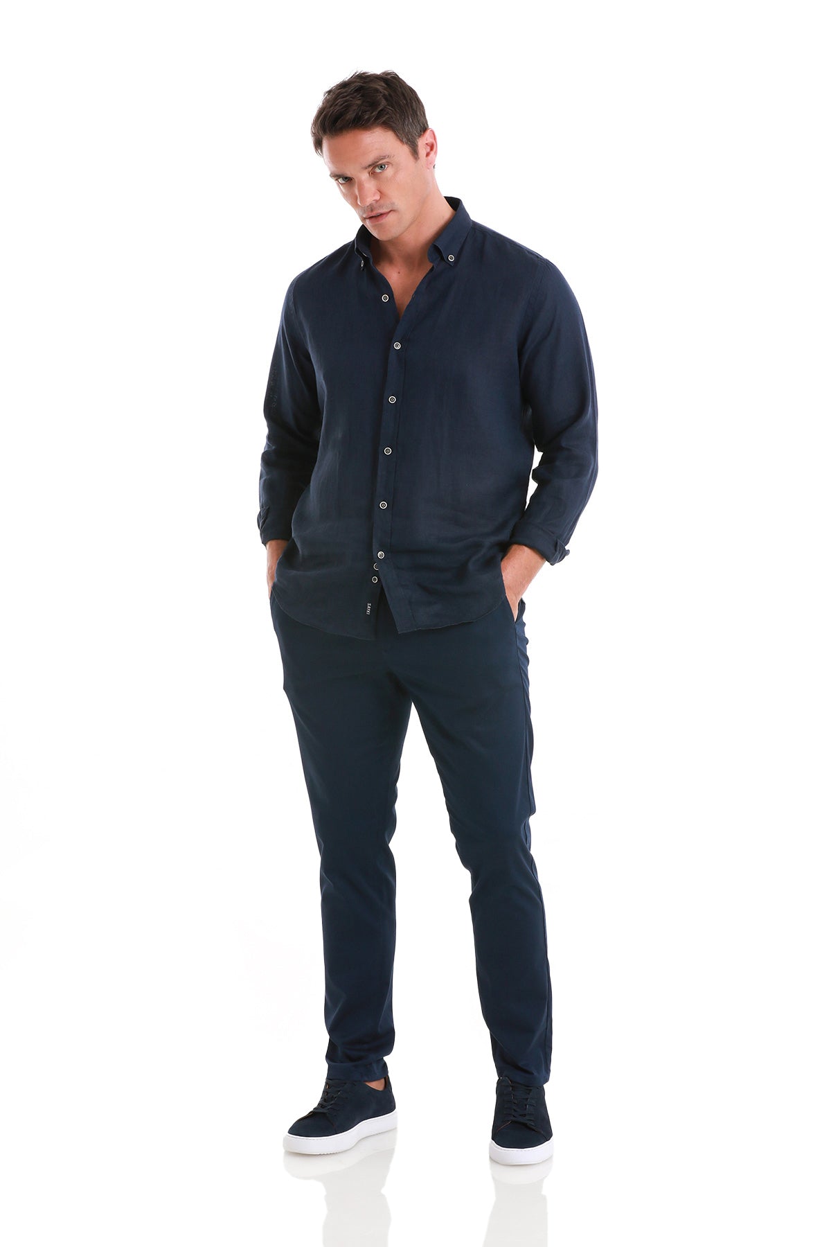 Navy blue linen button-down shirt with rolled-up sleeves and matching trousers