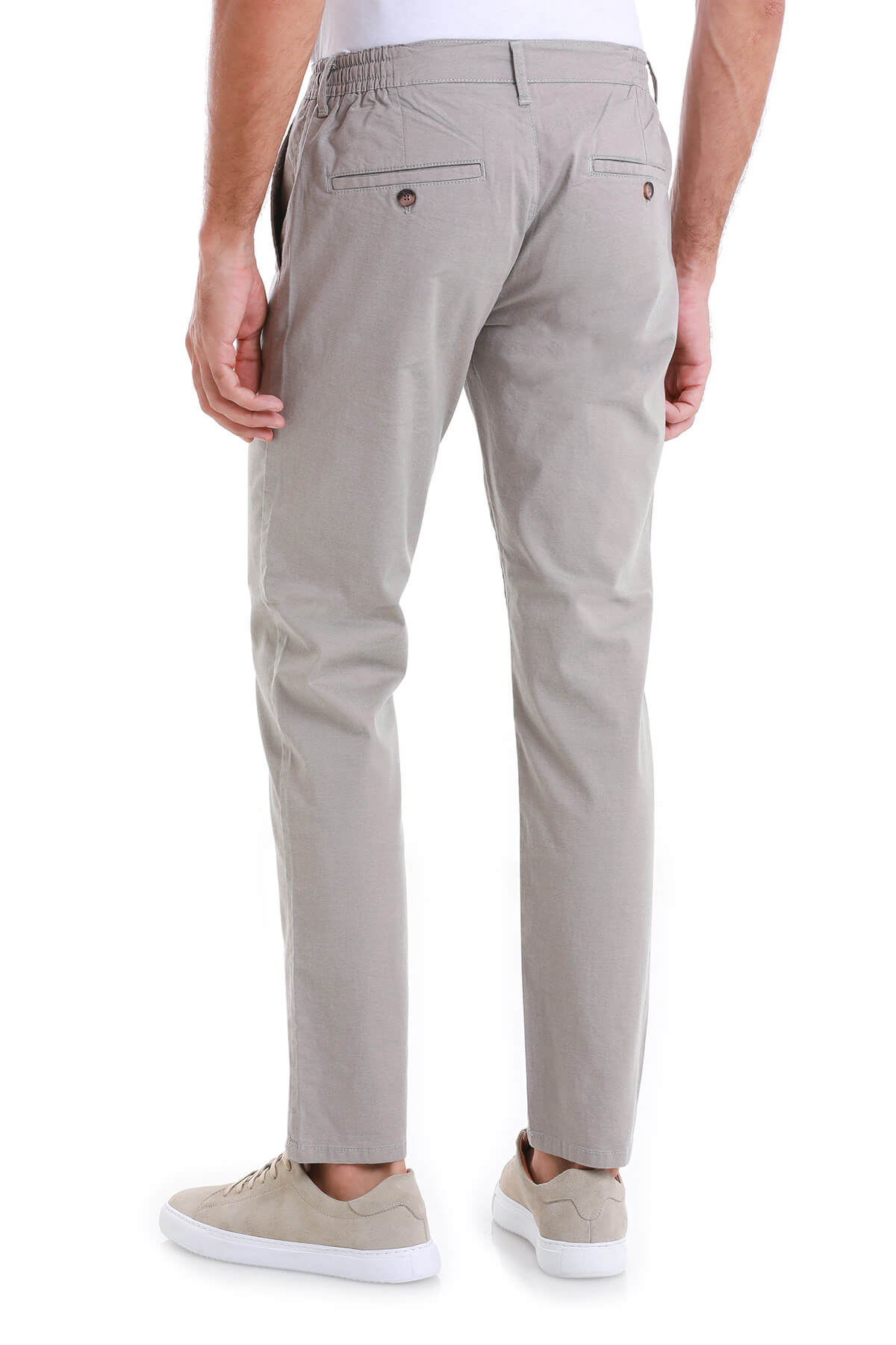 Beige chino trousers with a relaxed fit and elastic waistband.