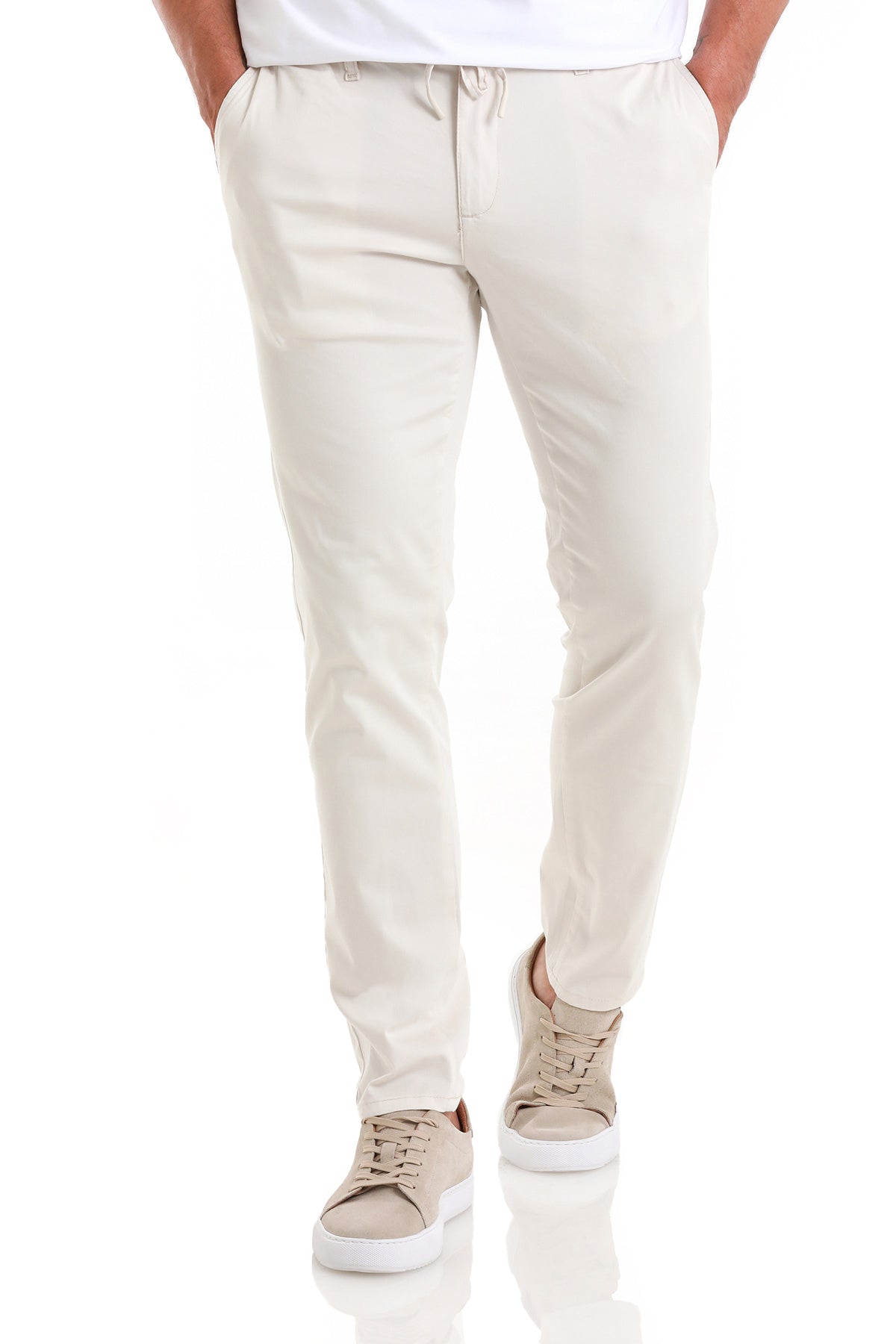 Beige drawstring pants with a slim fit and subtle creases.
