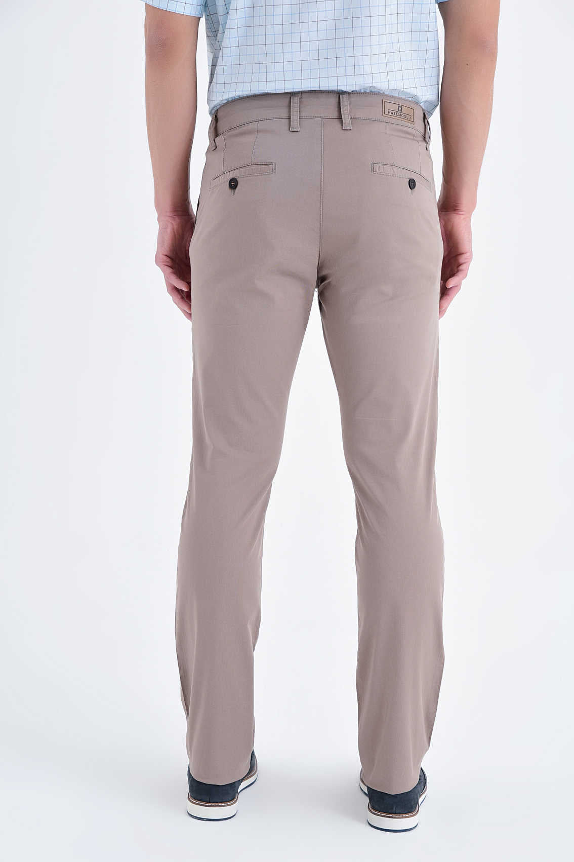 Beige chino pants with a classic fit and subtle stitching details.