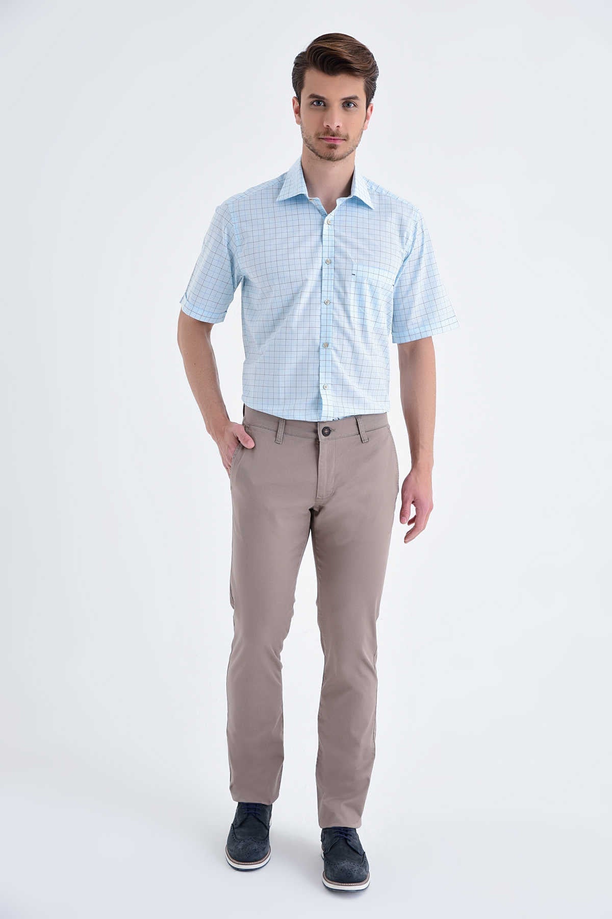 Light blue short-sleeved button-up shirt with a subtle grid pattern.