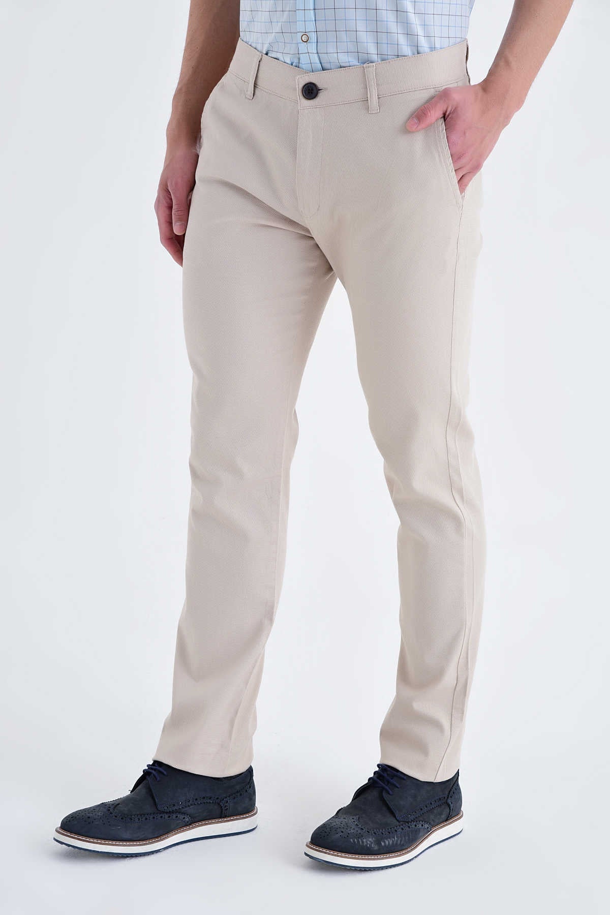 Beige chino trousers with a slim fit and black button closure.