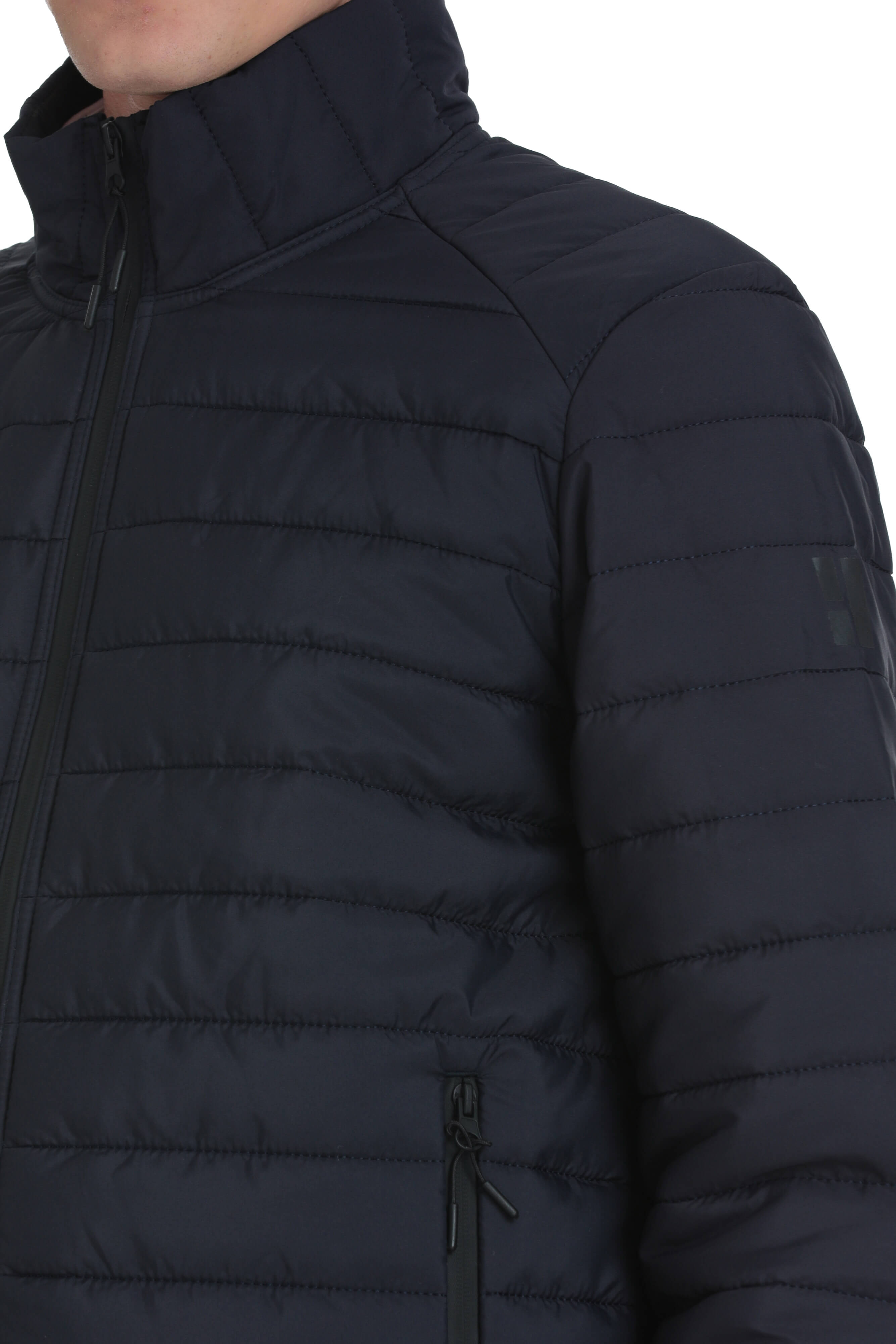 Dark navy quilted puffer jacket with a high collar and black zipper accents.
