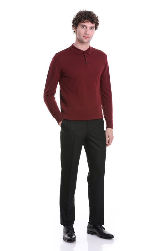 A man wearing a rich burgundy long-sleeved polo shirt with a classic collar and buttoned placket.
