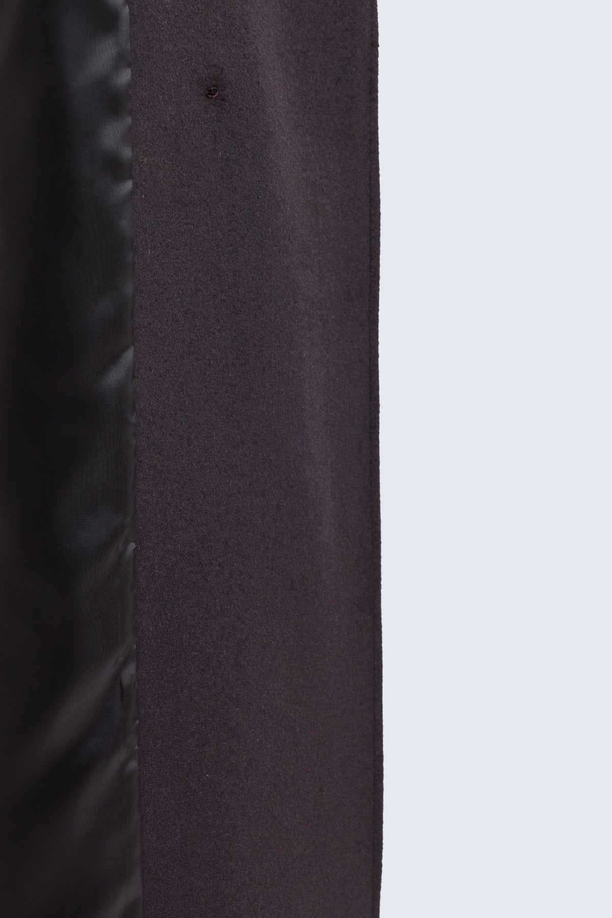 Dark gray fabric with subtle texture and visible stitching on sayki woman dynamic fit double-breasted wool blend coat