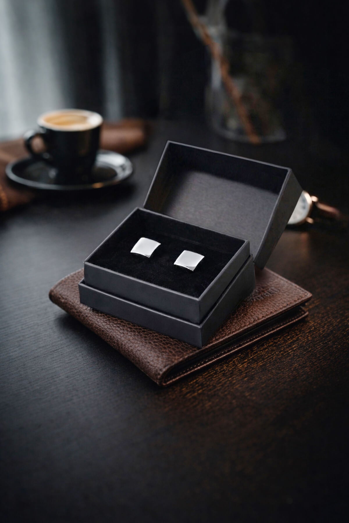 Silver toned natural stone square cufflinks displayed in a black gift box for formal wear